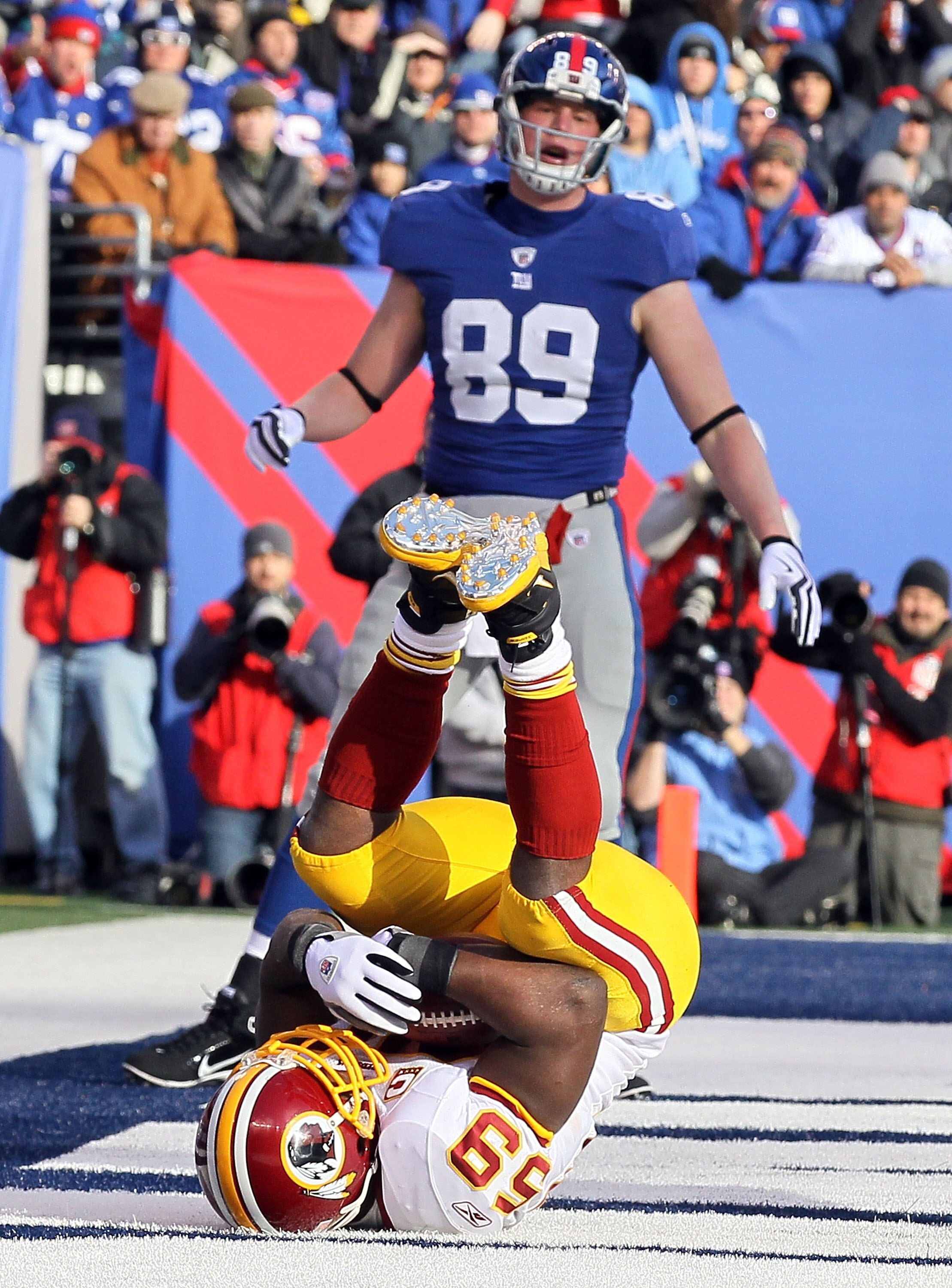 EAST RUTHERFORD, NJ - DECEMBER 05:  London Fletcher #59 of the Washington Redskins intercepts a pass in the endzone intended for Kevin Boss #89 of the New York Giants on December 5, 2010 at the New Meadowlands Stadium in East Rutherford, New Jersey.  (Pho