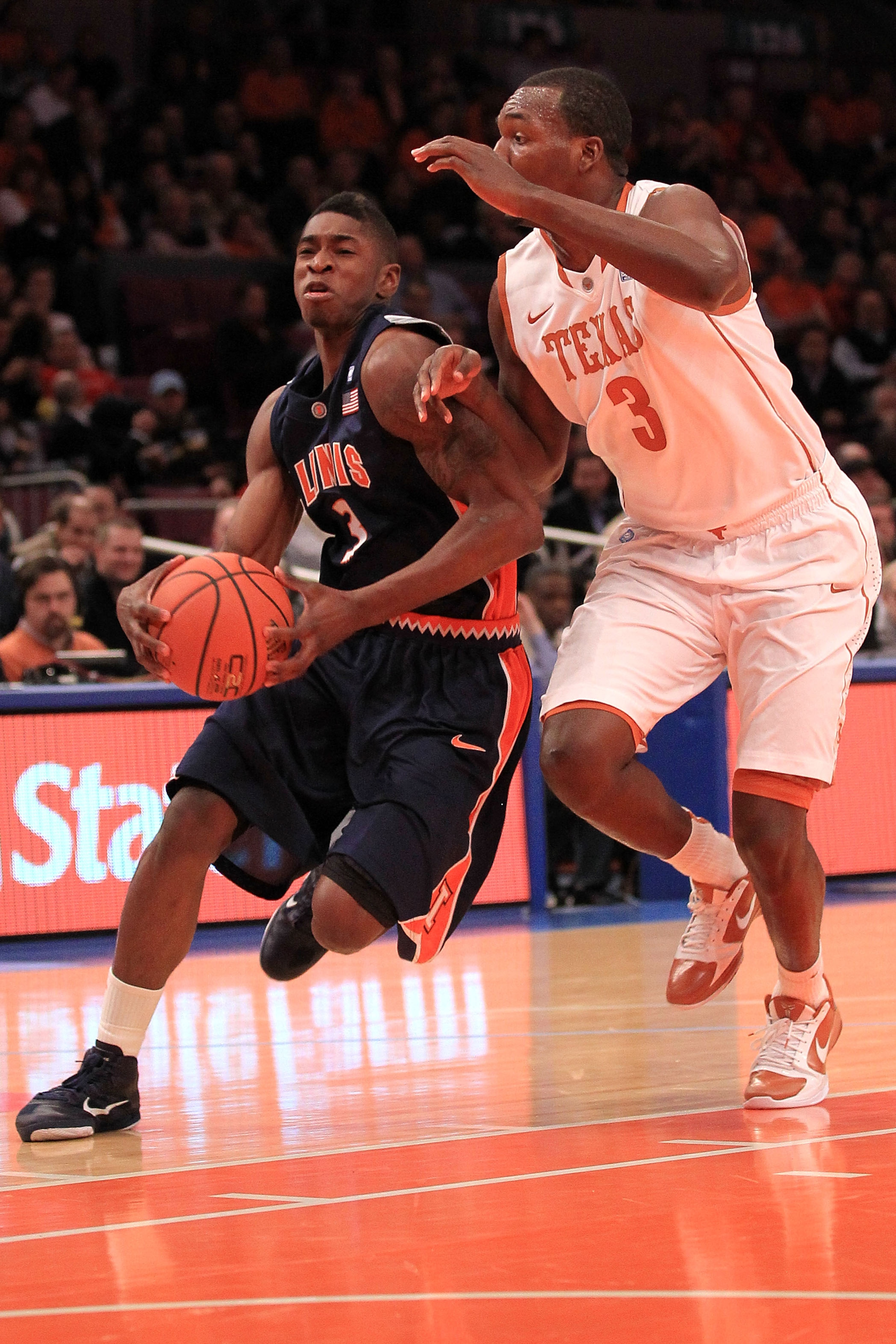 NEW YORK - NOVEMBER 18: Brandon Paul #3 of the Illinois Fighting Illini drives to the basket under pressure from Jordan Hamilton #3 of the Texas Longhorns during the 2k Sports Classic at Madison Square Garden on November 18, 2010 in New York, New York.  (