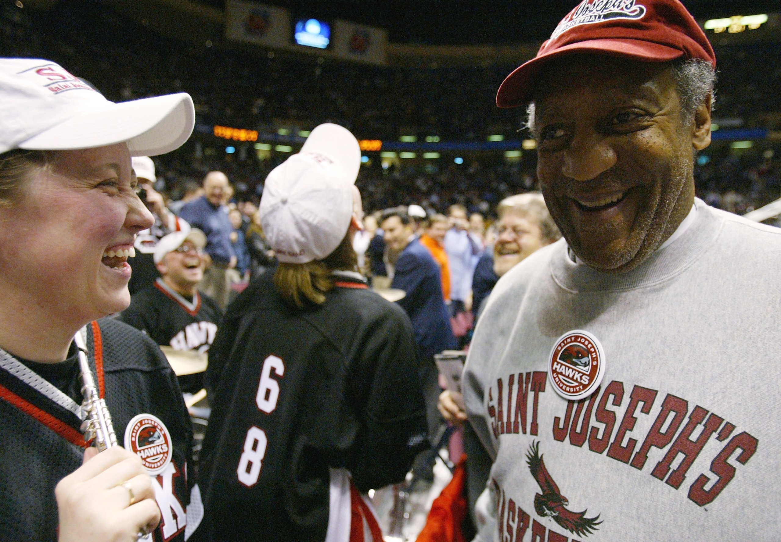 EAST RUTHERFORD, NJ - MARCH 25:  Actor and comedian Bill Cosby visits with members of the St. Joseph's Hawks band during their third round game of the NCAA Division I Men's Basketball Tournament against the Wake Forest Demon Deacons at Continental Airline