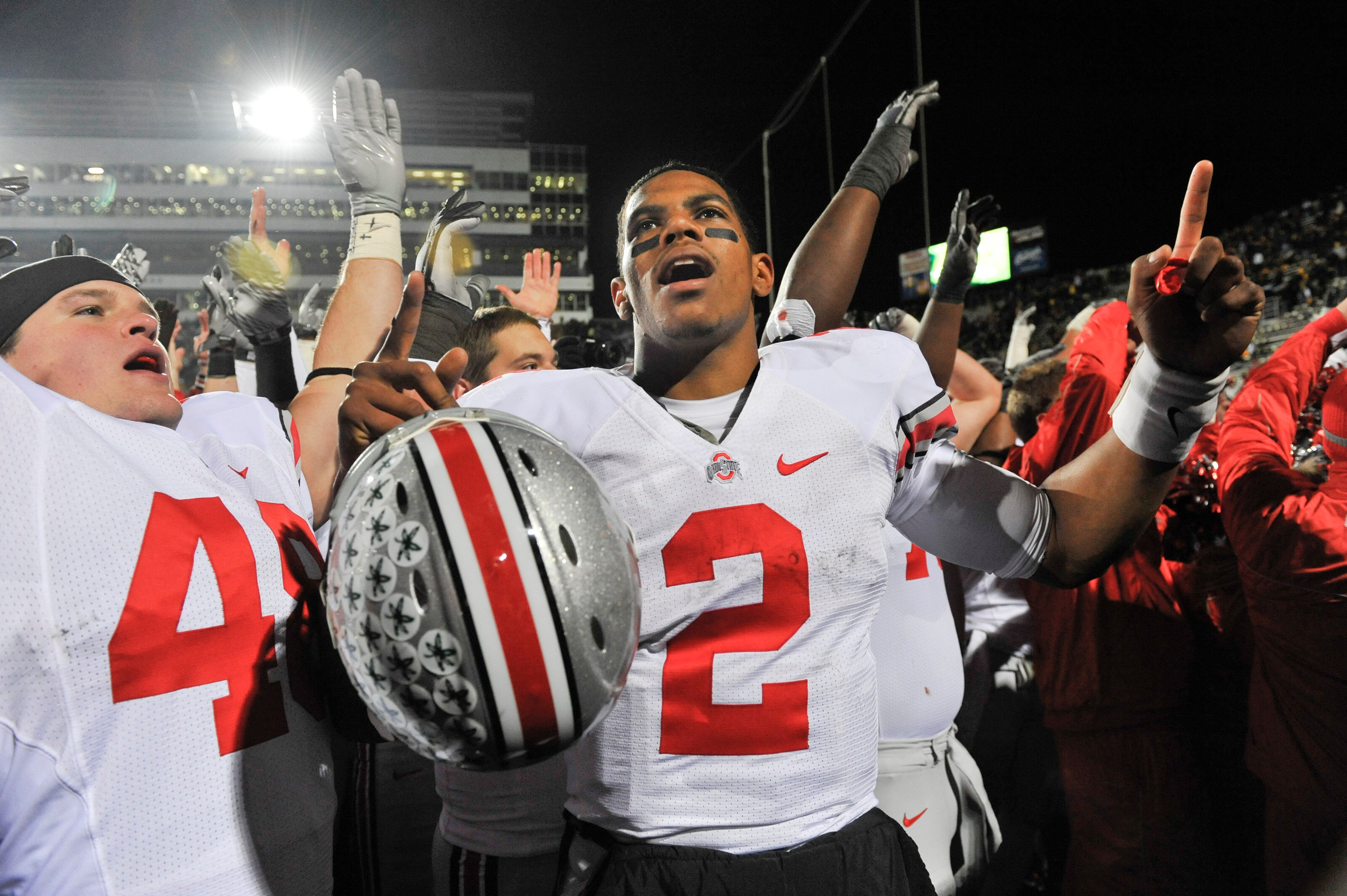 IOWA CITY, IA - NOVEMBER 20: Quarterback Terrelle Pryor #2 of the Ohio State Buckeyes celebrates with fans after beating the University of Iowa Hawkeyes at Kinnick Stadium on November 20, 2010 in Iowa City, Iowa. Ohio State won 20-17 over Iowa. (Photo by