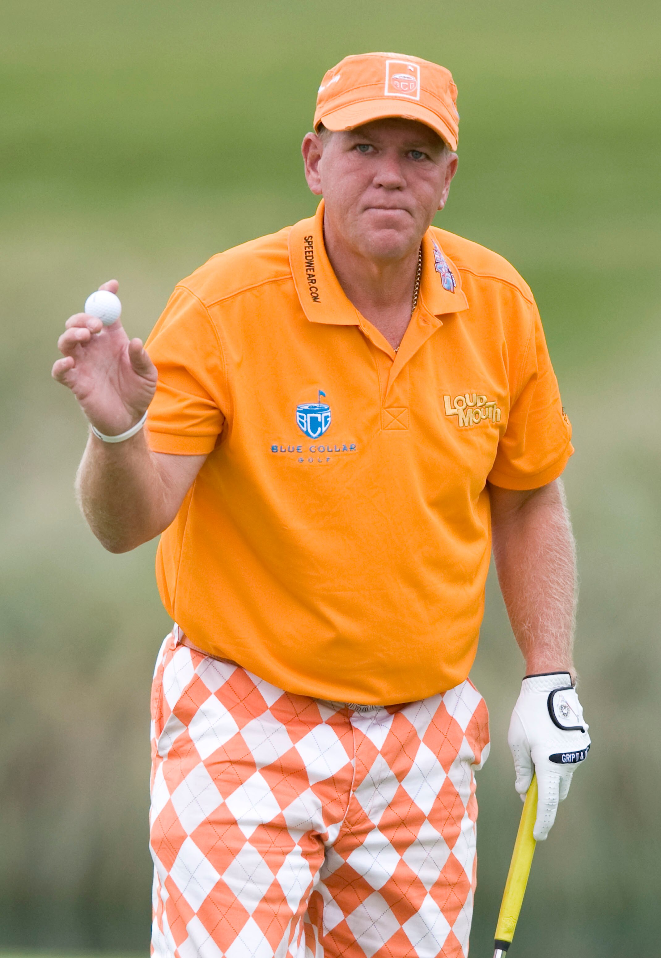 LAS VEGAS, NV - OCTOBER 21: John Daly acknowledges the crowd after sinking his putt on the 18th hole during the first round of the Justin Timberlake Shriners Hospitals for Children Open on October 21, 2010 in Las Vegas, Nevada. (Photo by Steve Dykes/Getty