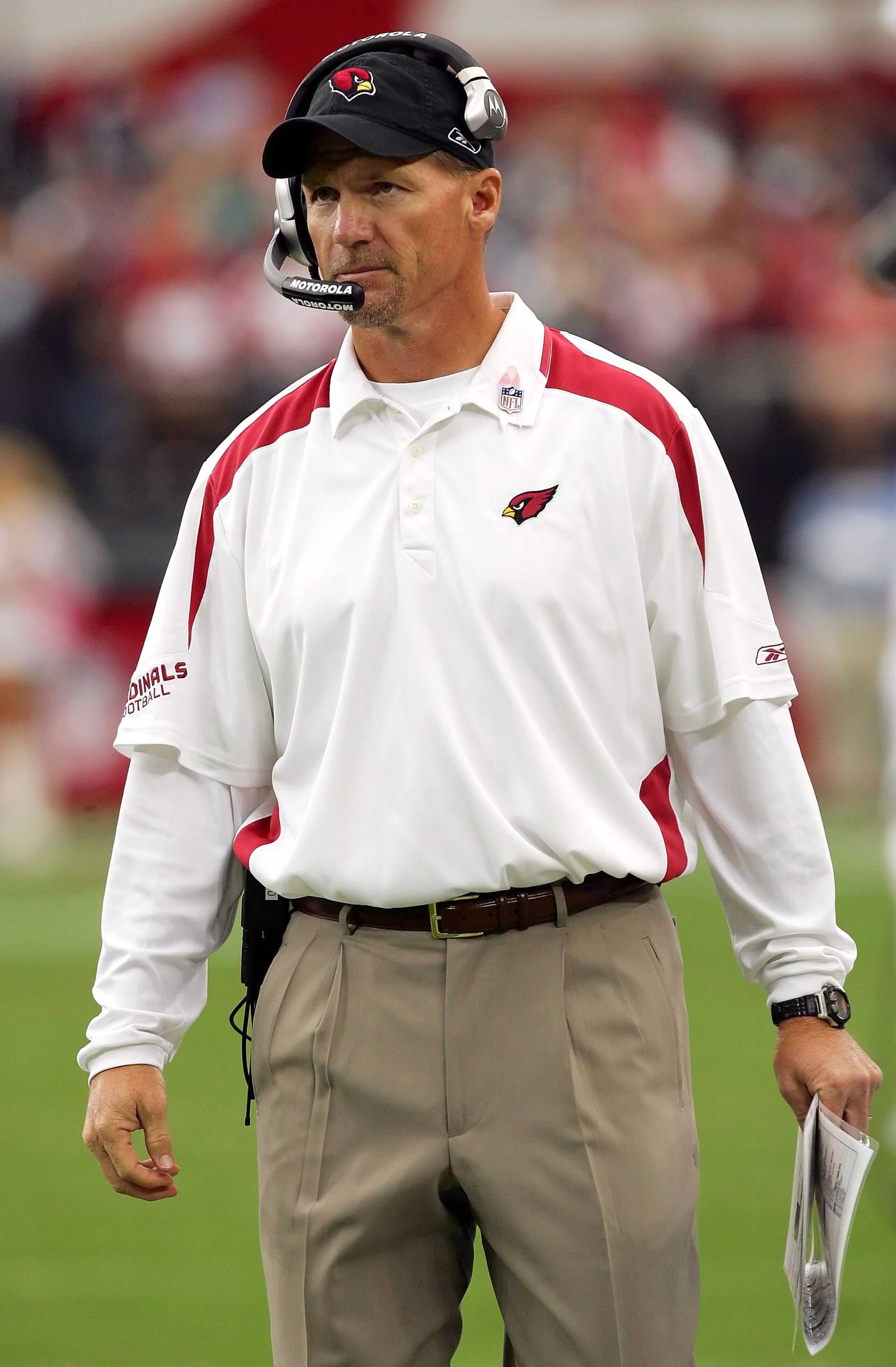 GLENDALE, AZ - OCTOBER 12:   Head coach Ken Wisenhunt of the Arizona Cardinals walks along the sideline during the game against the Dallas Cowboys at University of Phoenix Stadium on October 12, 2008 in Glendale, Arizona.  The Cardinals defeated the Cowbo