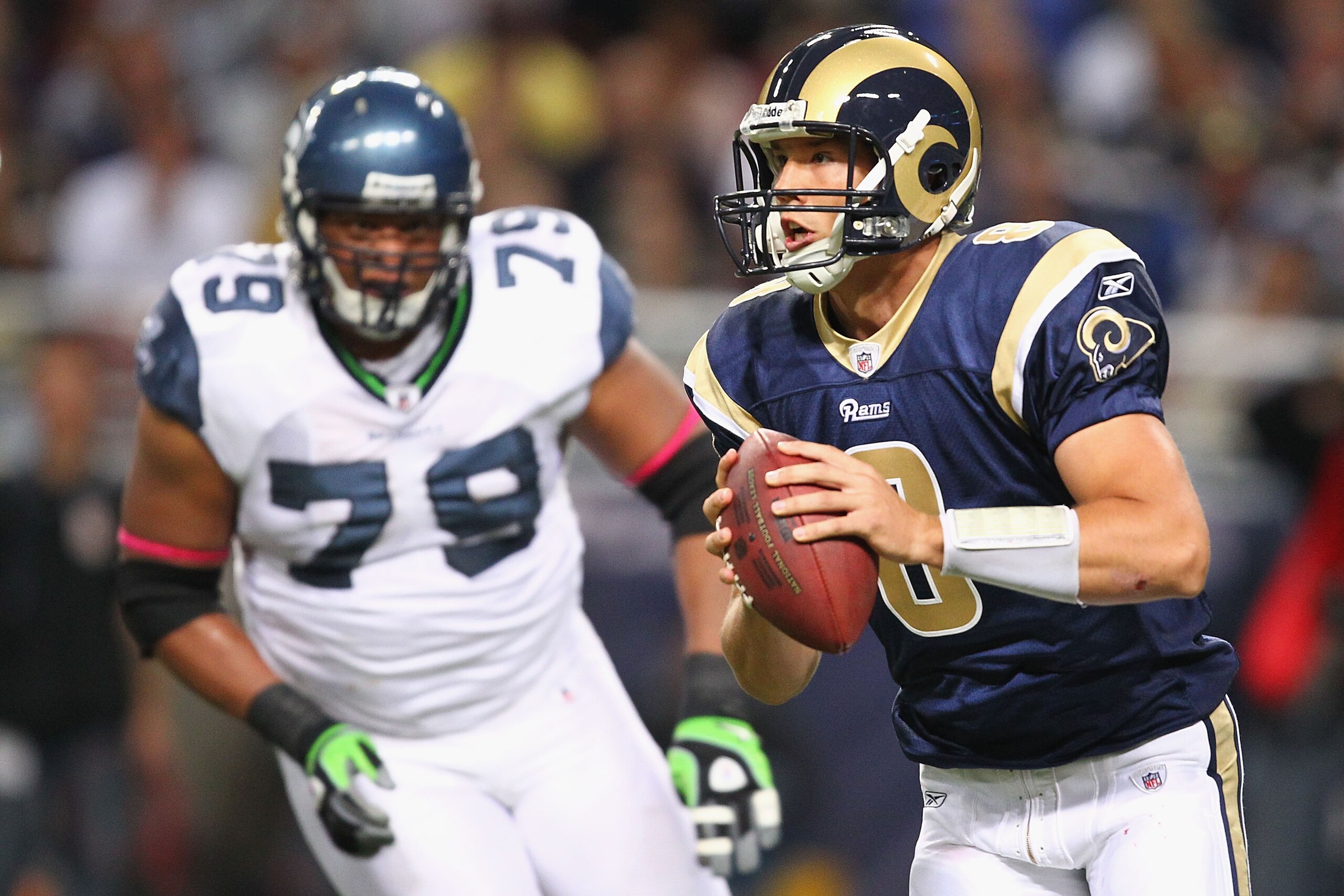 ST. LOUIS - OCTOBER 3: Sam Bradford #8 of the St. Louis Rams scrambles against the Seattle Seahawks at the Edward Jones Dome on October 3, 2010 in St. Louis, Missouri.  The Rams beat the Seahawks 20-3.  (Photo by Dilip Vishwanat/Getty Images)