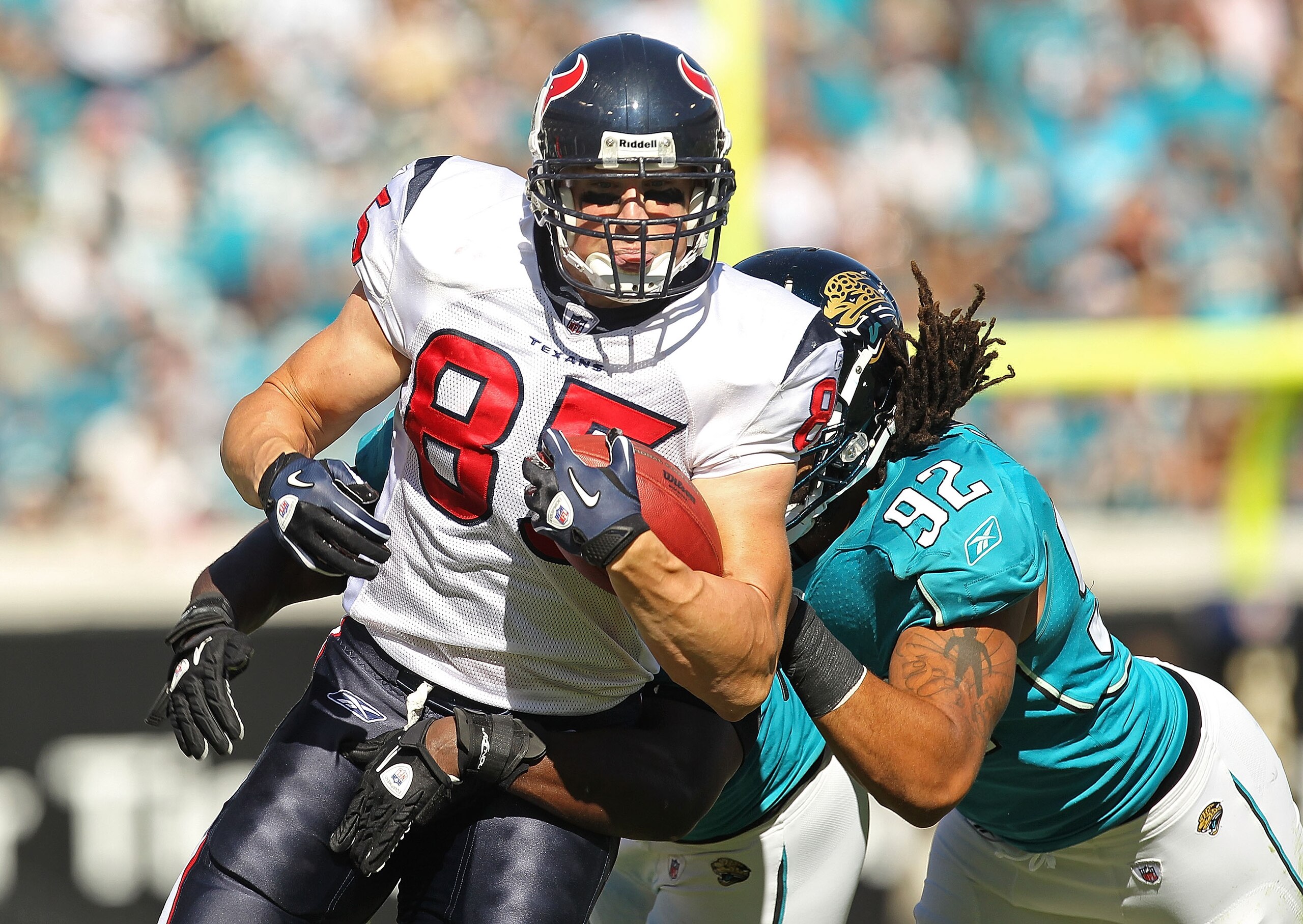 JACKSONVILLE, FL - NOVEMBER 14:  Joel Dreessen  #85 of the Houston Texans runs the ball before being tackled by Austen Lane #92 during a game against the Jacksonville Jaguars at EverBank Field on November 14, 2010 in Jacksonville, Florida.  (Photo by Mike