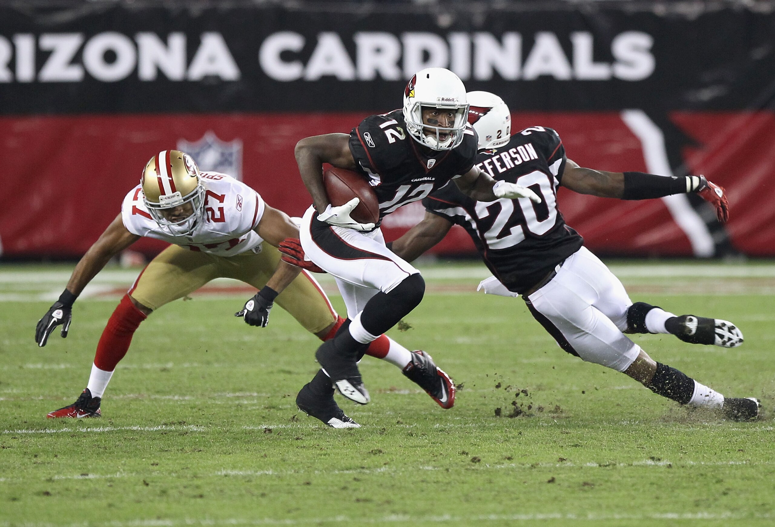 GLENDALE, AZ - NOVEMBER 29:  Wide reciever Andre Roberts #12 of the Arizona Cardinals runs with the football after a reception against the San Francisco 49ers during the NFL game at the University of Phoenix Stadium on November 29, 2010 in Glendale, Arizo