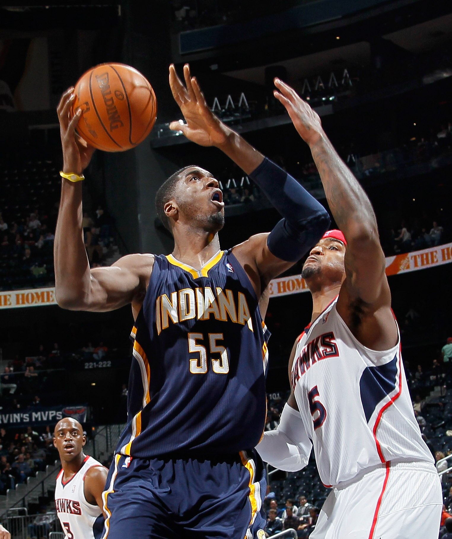 ATLANTA, GA - DECEMBER 11:  Roy Hibbert #55 of the Indiana Pacers drives against Josh Smith #5 of the Atlanta Hawks at Philips Arena on December 11, 2010 in Atlanta, Georgia.  NOTE TO USER: User expressly acknowledges and agrees that, by downloading and/o