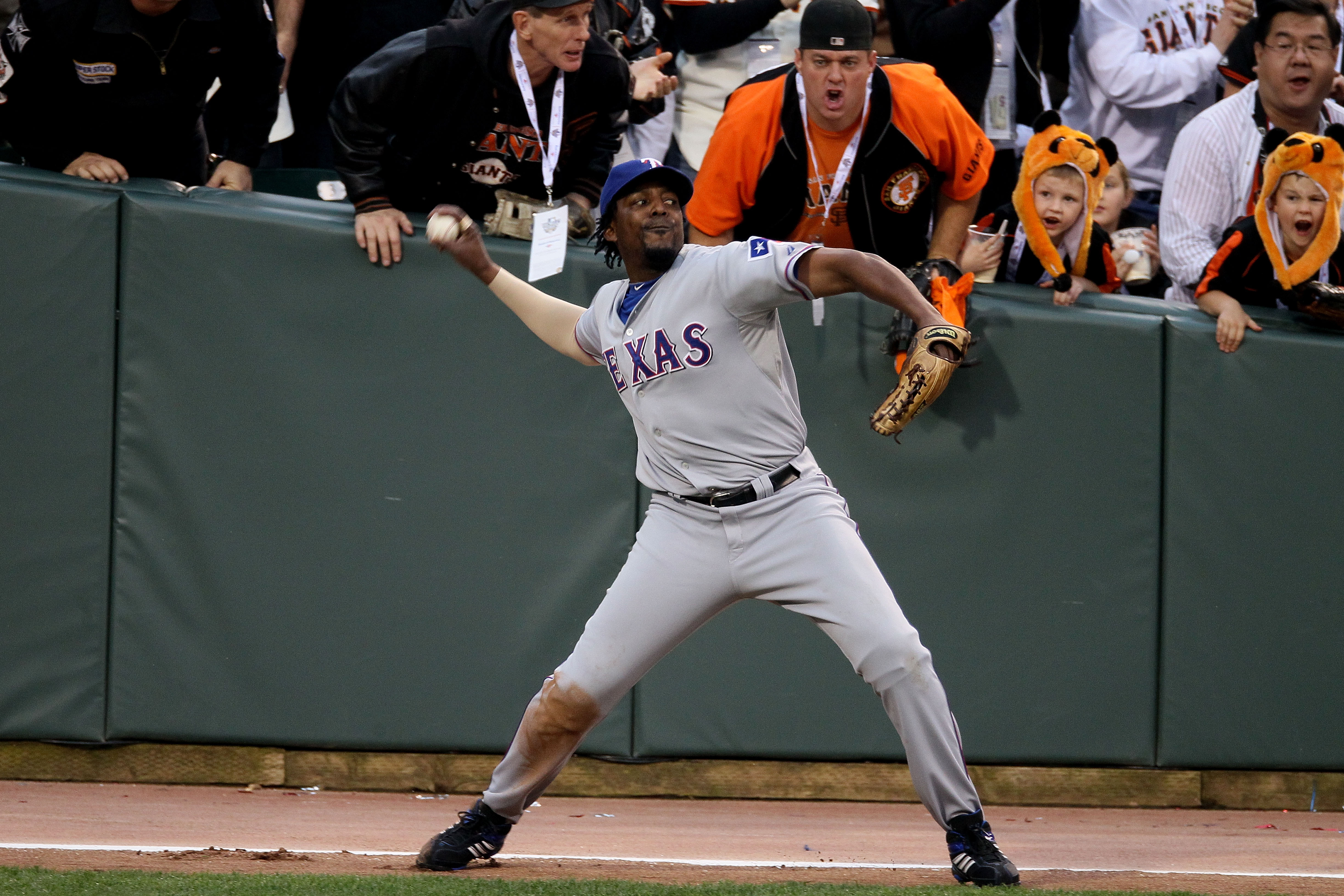 SAN FRANCISCO - OCTOBER 27:   Vladimir Guerrero #27 of the Texas Rangers fields a ball against the San Francisco Giants in Game One of the 2010 MLB World Series at AT&T Park on October 27, 2010 in San Francisco, California.  (Photo by Elsa/Getty Images)