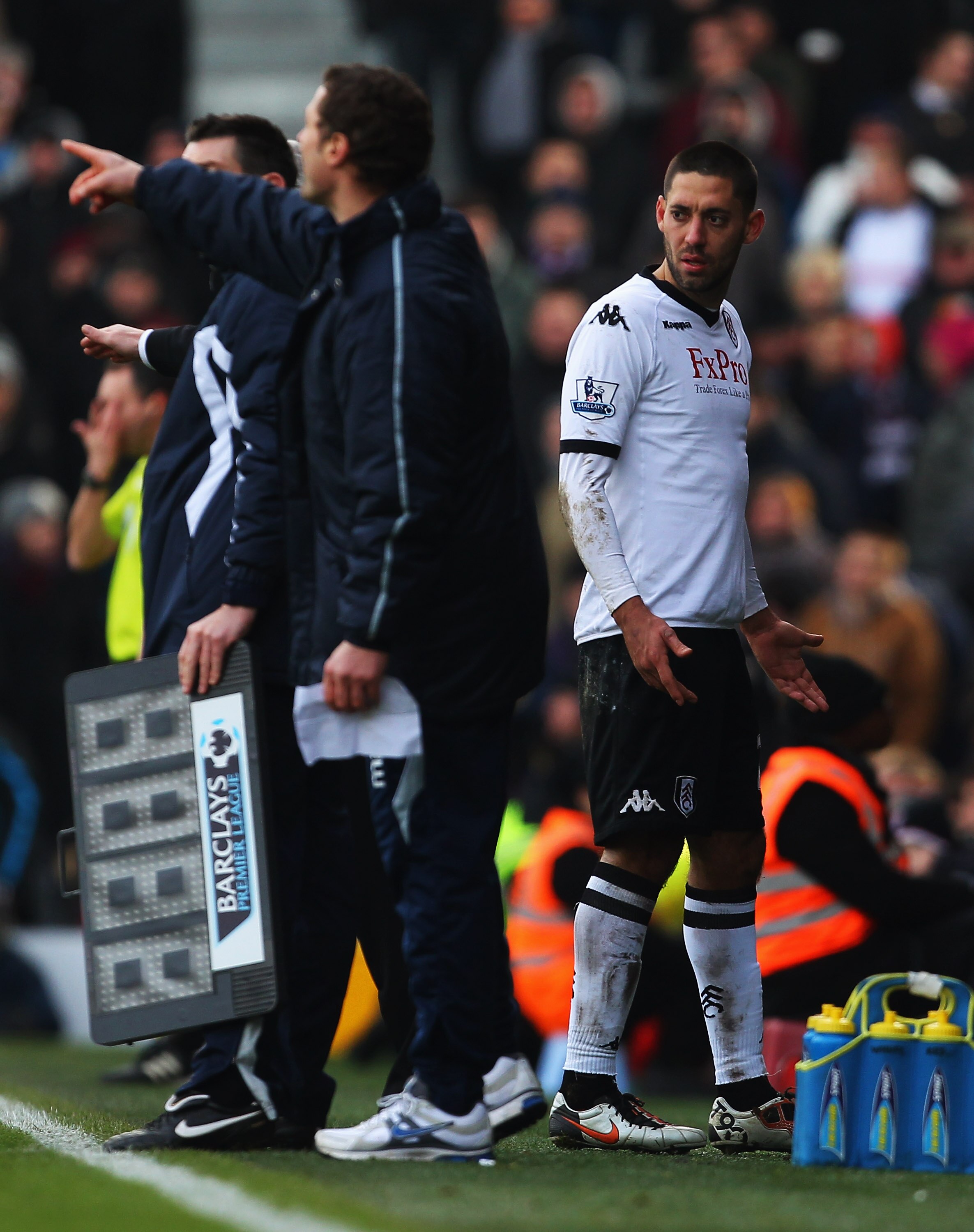 LONDON, ENGLAND - DECEMBER 26:  Clint Dempsey of Fulham (R) looks perplexed as he is substituted during the Barclays Premier League match between Fulham and West Ham United at Craven Cottage on December 26, 2010 in London, England.  (Photo by Clive Rose/G