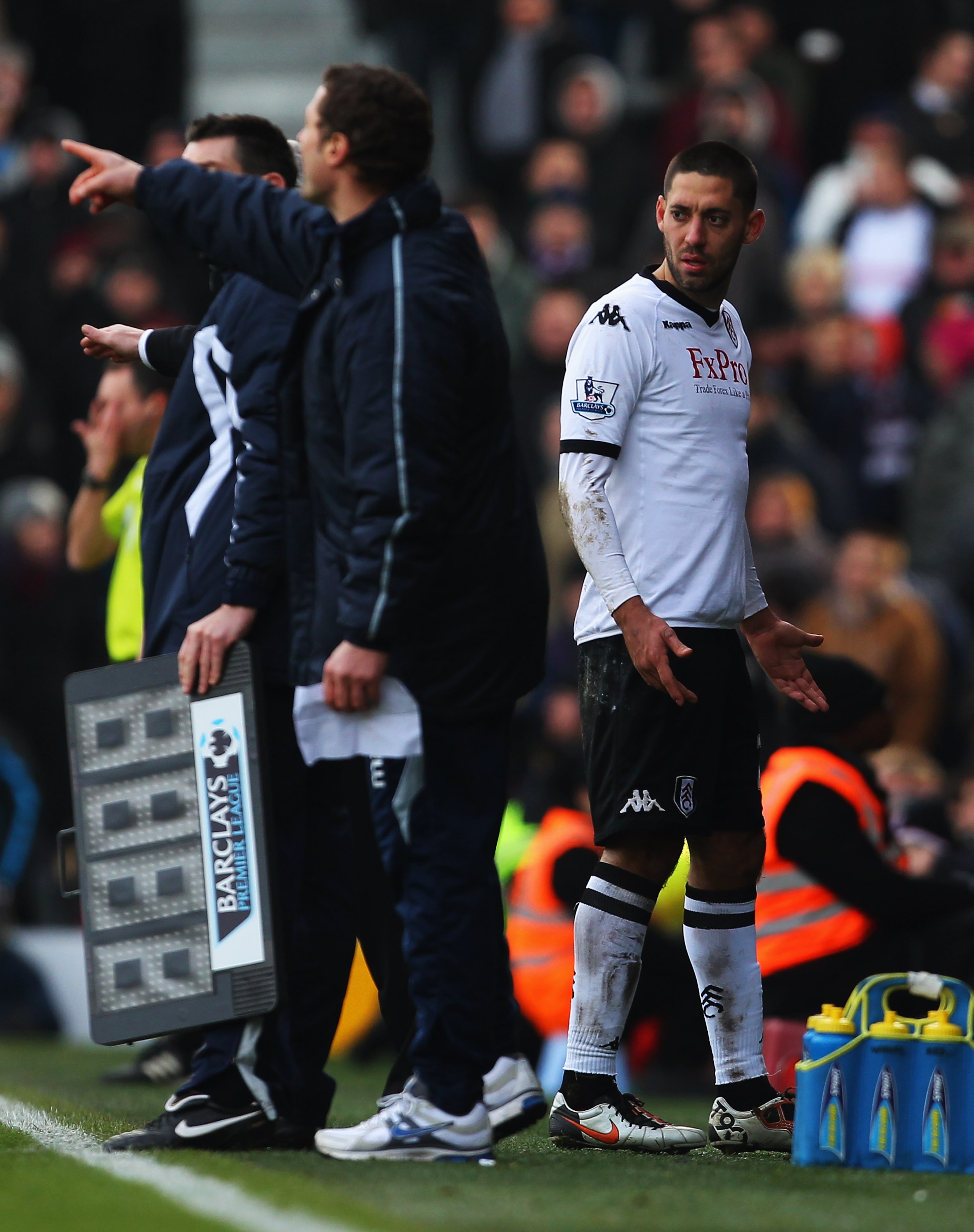 LONDON, ENGLAND - DECEMBER 26:  Clint Dempsey of Fulham (R) looks perplexed as he is substituted during the Barclays Premier League match between Fulham and West Ham United at Craven Cottage on December 26, 2010 in London, England.  (Photo by Clive Rose/G