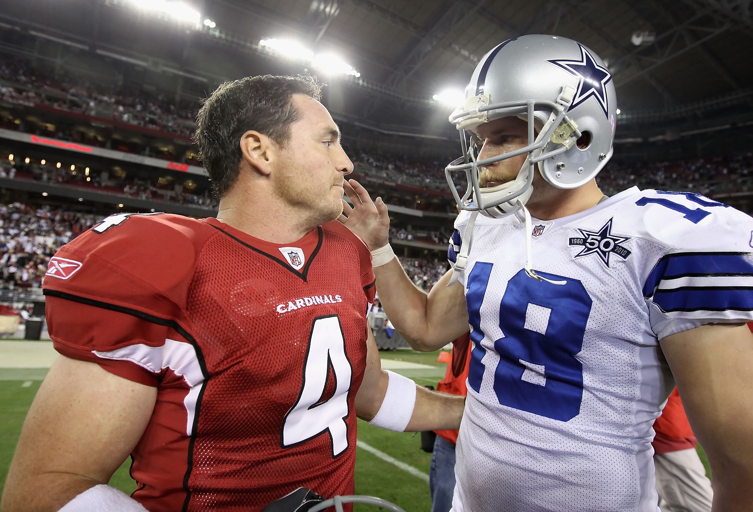GLENDALE, AZ - DECEMBER 25:  Kicker Jay Feely #4 of the Arizona Cardinals talks with David Buehler #18 of the Dallas Cowboys following the NFL game at the University of Phoenix Stadium on December 25, 2010 in Glendale, Arizona. The Cardinals defeated the