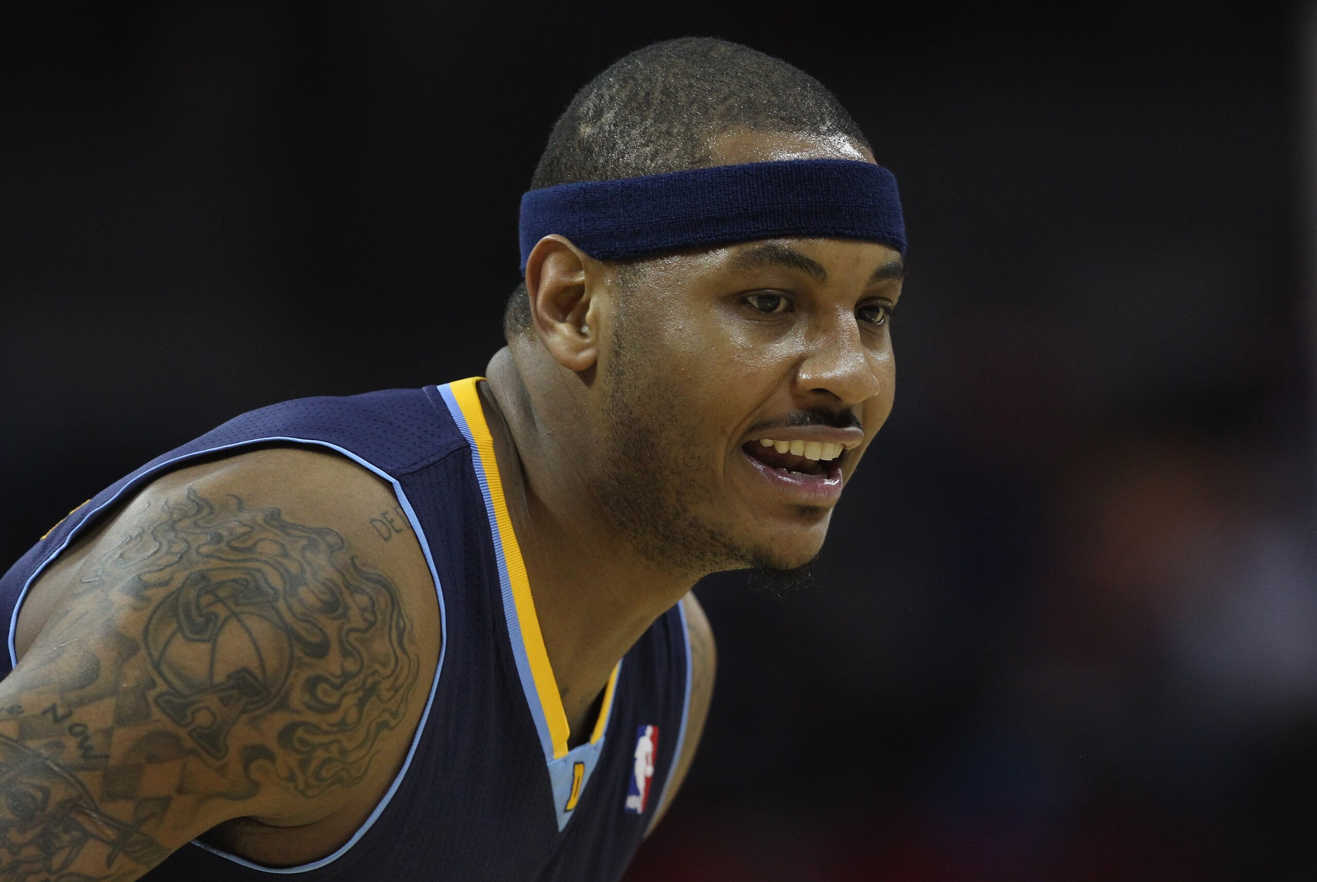 CHARLOTTE, NC - DECEMBER 07: Carmelo Anthony #15 of the Denver Nuggets watches on against the Charlotte Bobcats during their game at Time Warner Cable Arena on December 7, 2010 in Charlotte, North Carolina. NOTE TO USER: User expressly acknowledges and CHARLOTTE, NC - DECEMBER 07: Carmelo Anthony #15 of the Denver Nuggets watches on against the Charlotte Bobcats during their game at Time Warner Cable Arena on December 7, 2010 in Charlotte, North Carolina. NOTE TO USER: User expressly acknowledges and