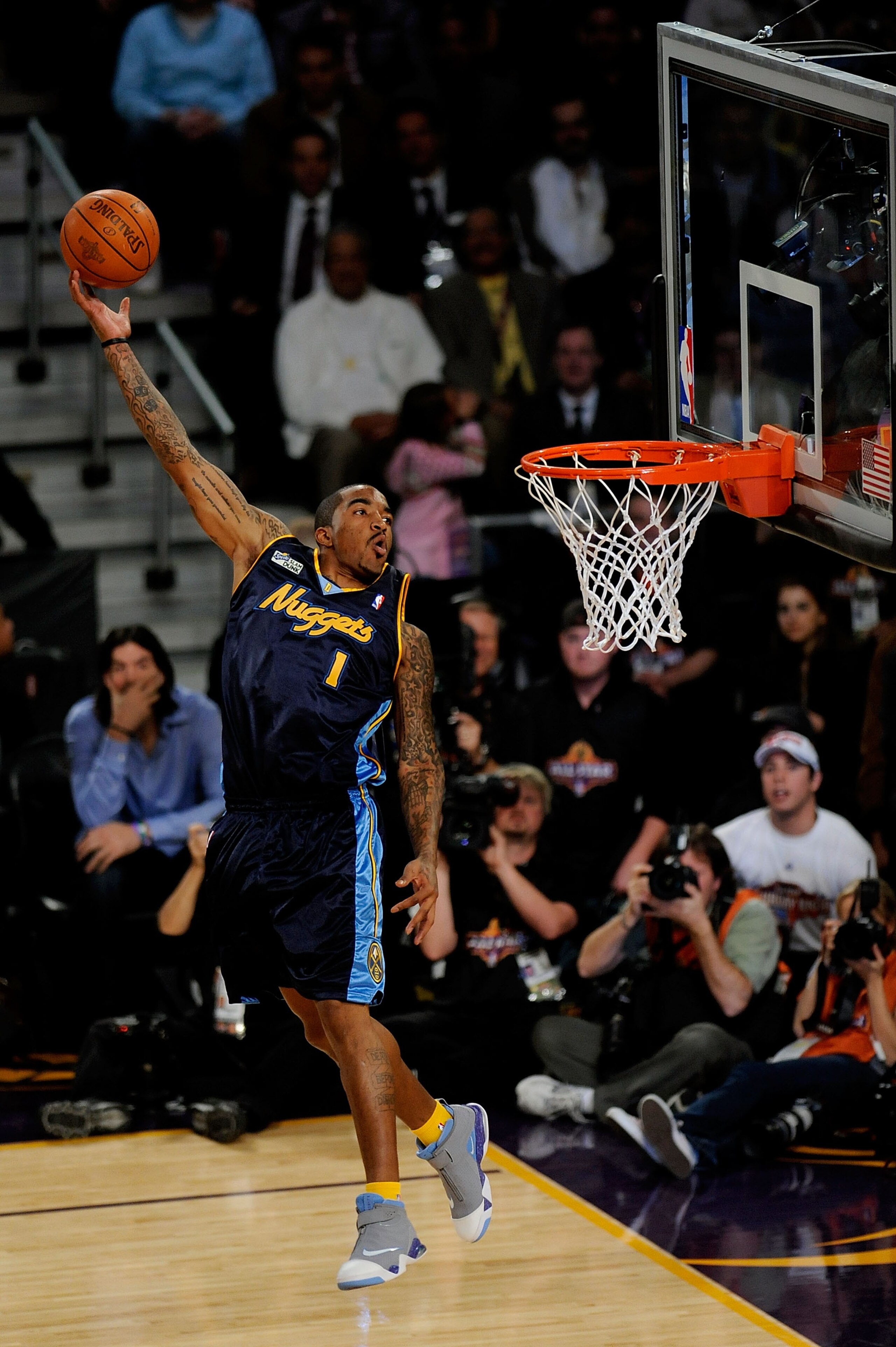 PHOENIX - FEBRUARY 14: J.R. Smith of the Denver Nuggets participates in the Sprite Slam Dunk Contest on All-Star Saturday Night, part of 2009 NBA All-Star Weekend at US Airways Center on February 14, 2009 in Phoenix, Arizona. NOTE TO USER: User expressl PHOENIX - FEBRUARY 14: J.R. Smith of the Denver Nuggets participates in the Sprite Slam Dunk Contest on All-Star Saturday Night, part of 2009 NBA All-Star Weekend at US Airways Center on February 14, 2009 in Phoenix, Arizona. NOTE TO USER: User expressl