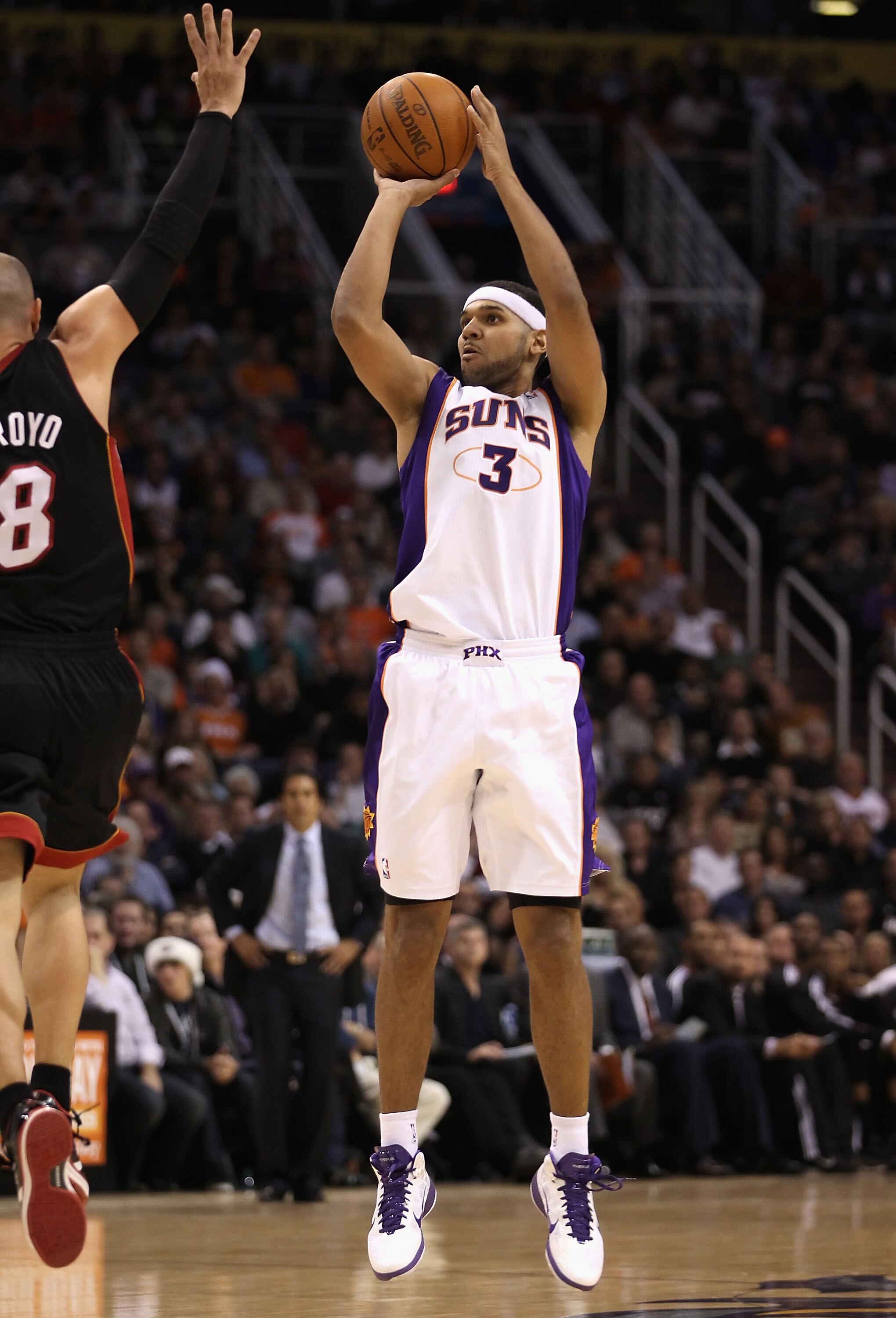 PHOENIX - DECEMBER 23:  Jared Dudley #3 of the Phoenix Suns puts up a three point shot against the Miami Heat during the NBA game at US Airways Center on December 23, 2010 in Phoenix, Arizona. NOTE TO USER: User expressly acknowledges and agrees that, by 