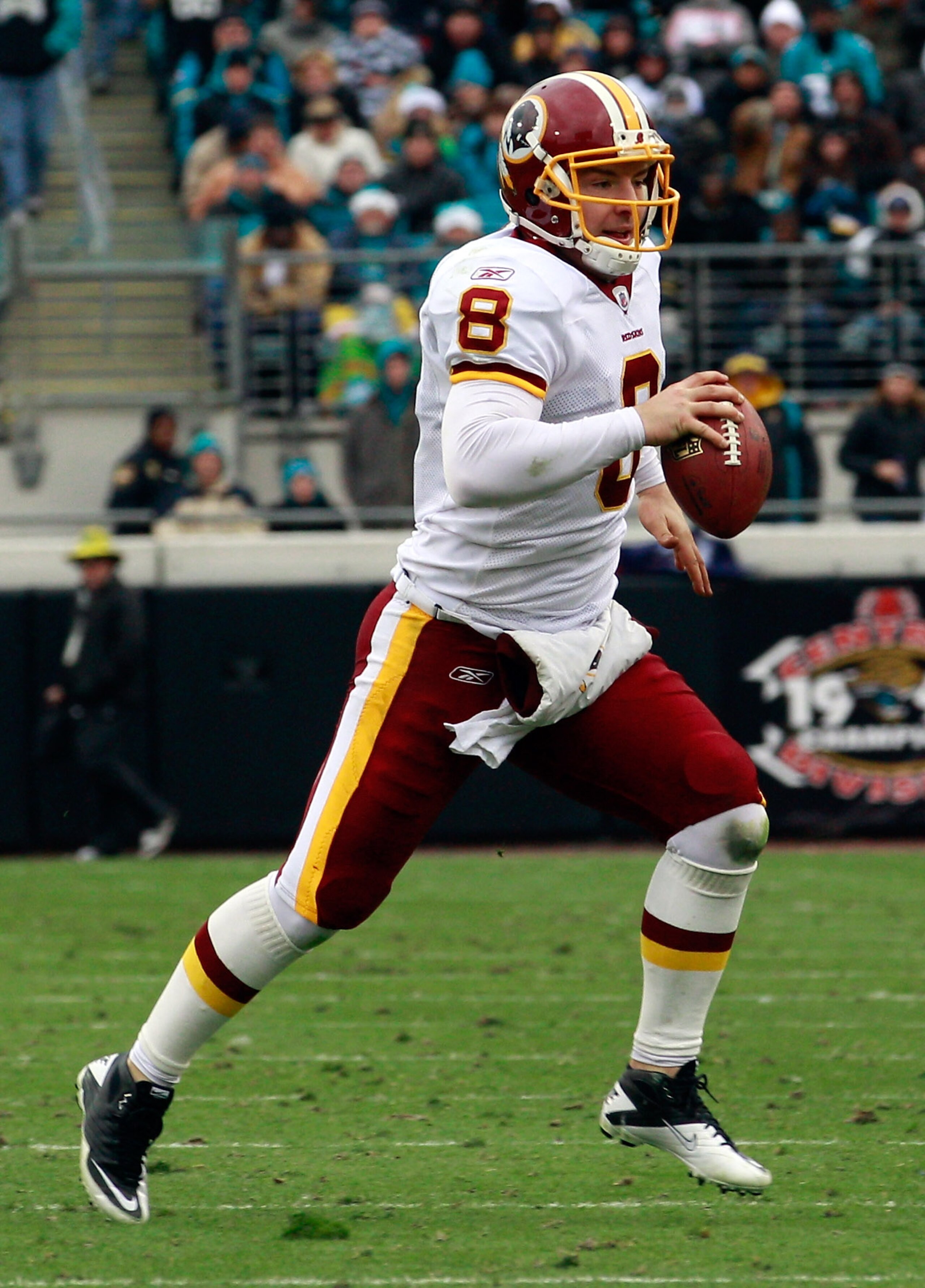 JACKSONVILLE, FL - DECEMBER 26:  Quarterback Rex Grossman #8 of the Washington Redskins scrambles for yardage during the game against the Jacksonville Jaguars at EverBank Field on December 26, 2010 in Jacksonville, Florida.  (Photo by Sam Greenwood/Getty
