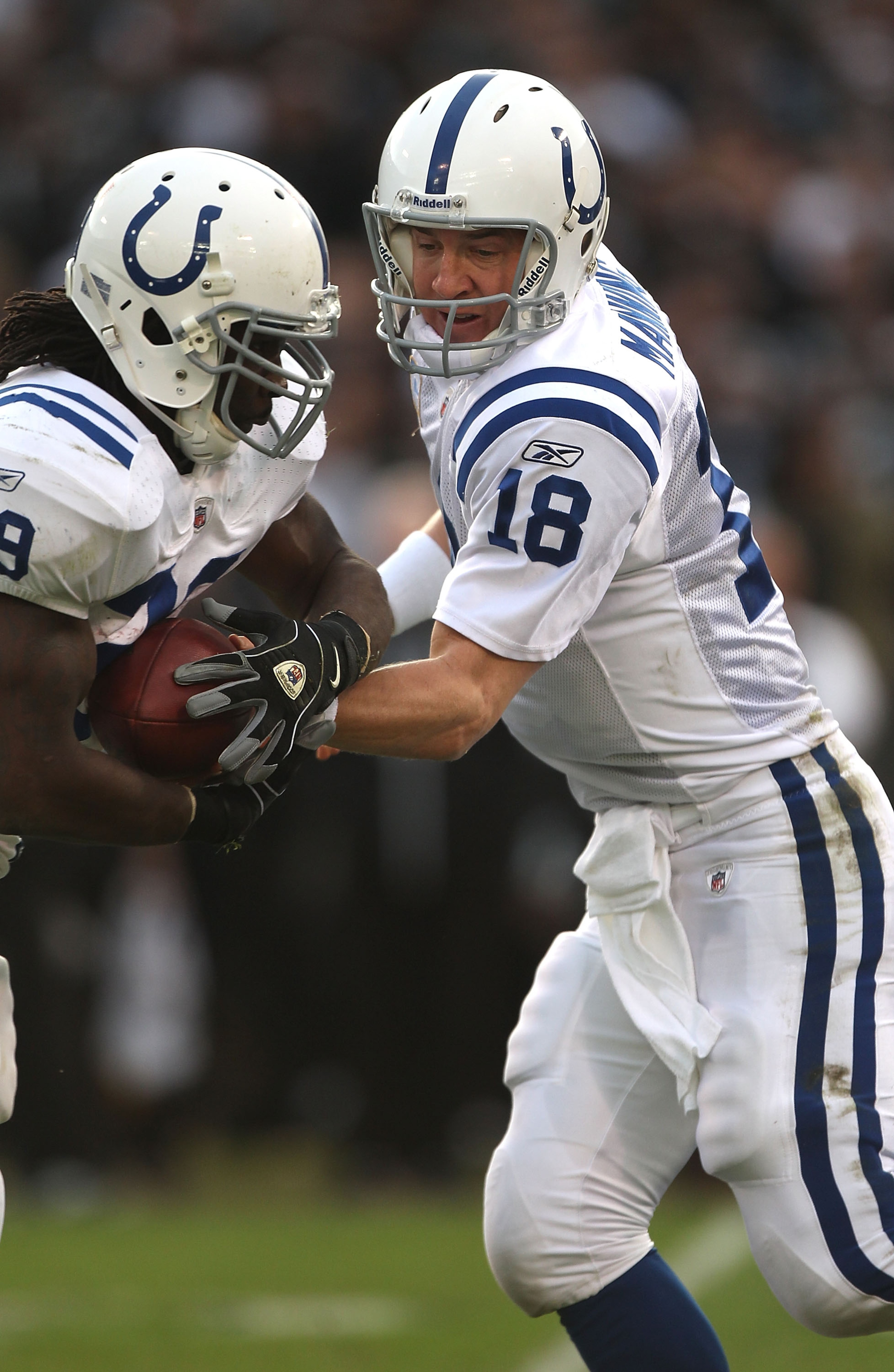 OAKLAND, CA - DECEMBER 26: Peyton Manning #18 of the Indianapolis Colts hands off to Joseph Addai #29 against the Oakland Raiders during an NFL game at Oakland-Alameda County Coliseum on December 26, 2010 in Oakland, California. (Photo by Jed Jacobsohn OAKLAND, CA - DECEMBER 26: Peyton Manning #18 of the Indianapolis Colts hands off to Joseph Addai #29 against the Oakland Raiders during an NFL game at Oakland-Alameda County Coliseum on December 26, 2010 in Oakland, California. (Photo by Jed Jacobsohn