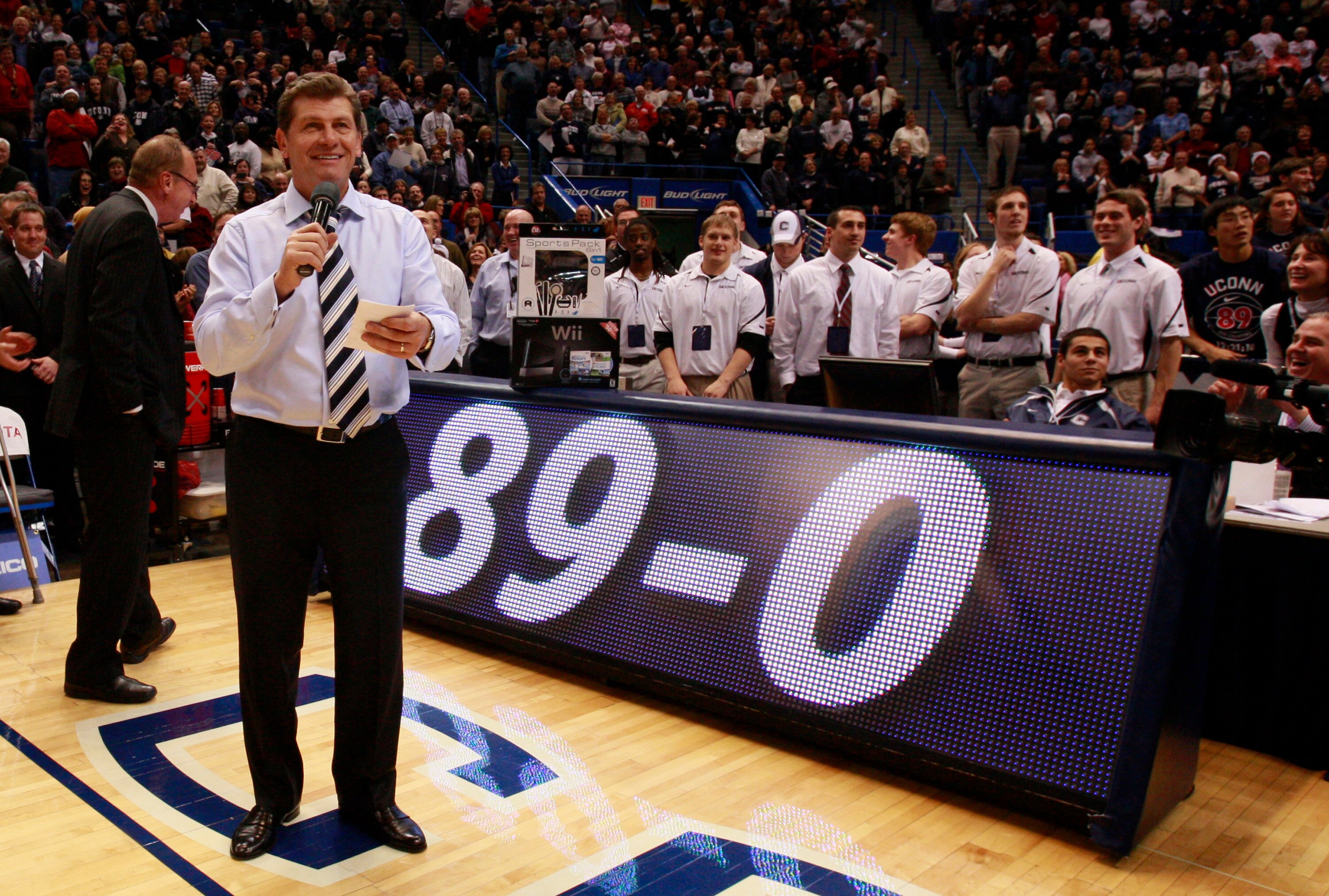 HARTFORD, CT - DECEMBER 21:  Coach Geno Auriemma of Connecticut celebrates a win over  Florida State on December 21, 2010 in Hartford, Connecticut.  Connecticut set a record with 89 straight wins without a defeat. (Photo by Jim Rogash/Getty Images)