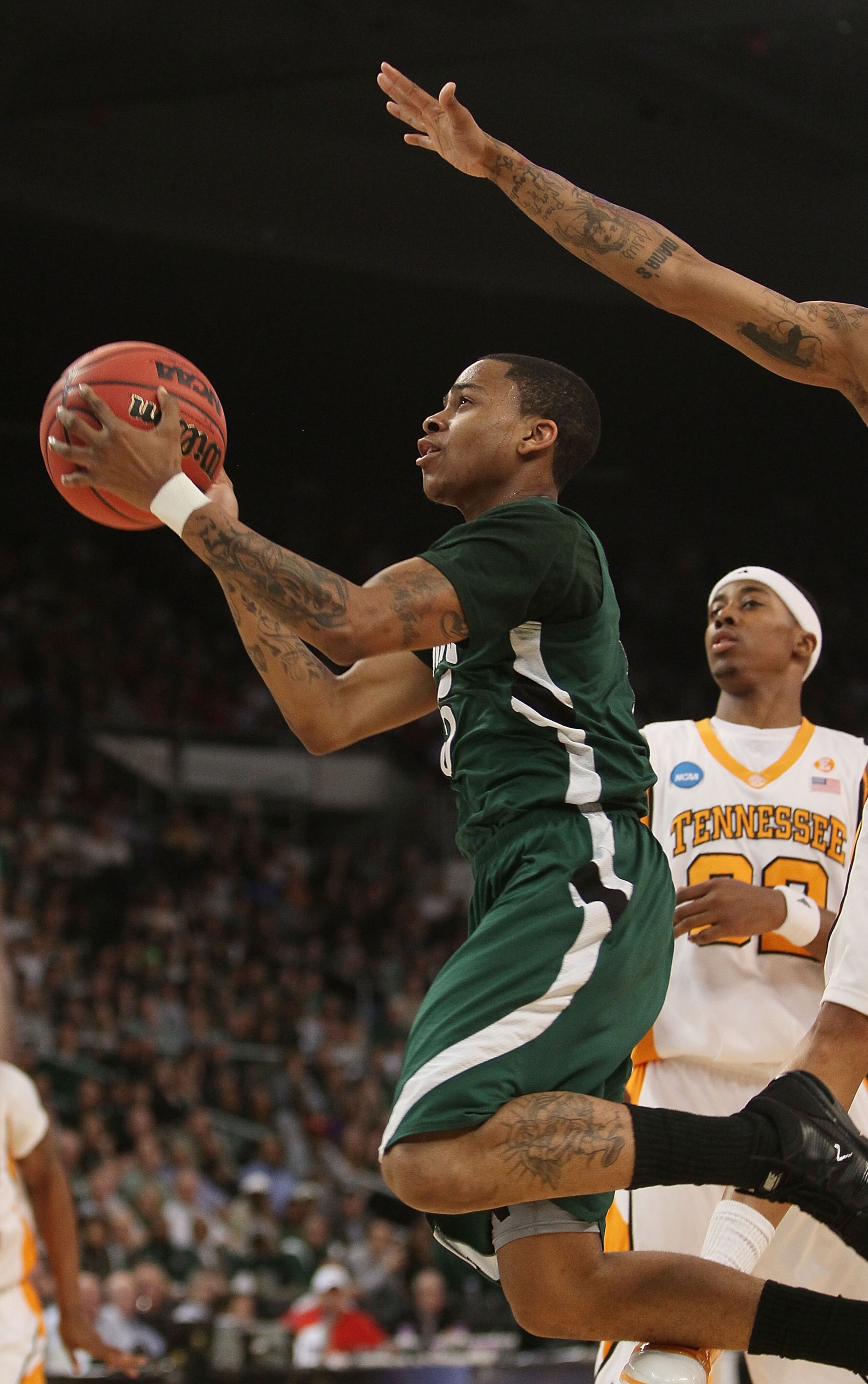 PROVIDENCE, RI - MARCH 20:  D.J. Cooper #5 of the Ohio Bobcats heads for the net as Scotty Hopson #32 of the Tennessee Volunteers defends during the second round of the 2010 NCAA men's basketball tournament on March 20, 2010 at the Dunkin Donuts Center in