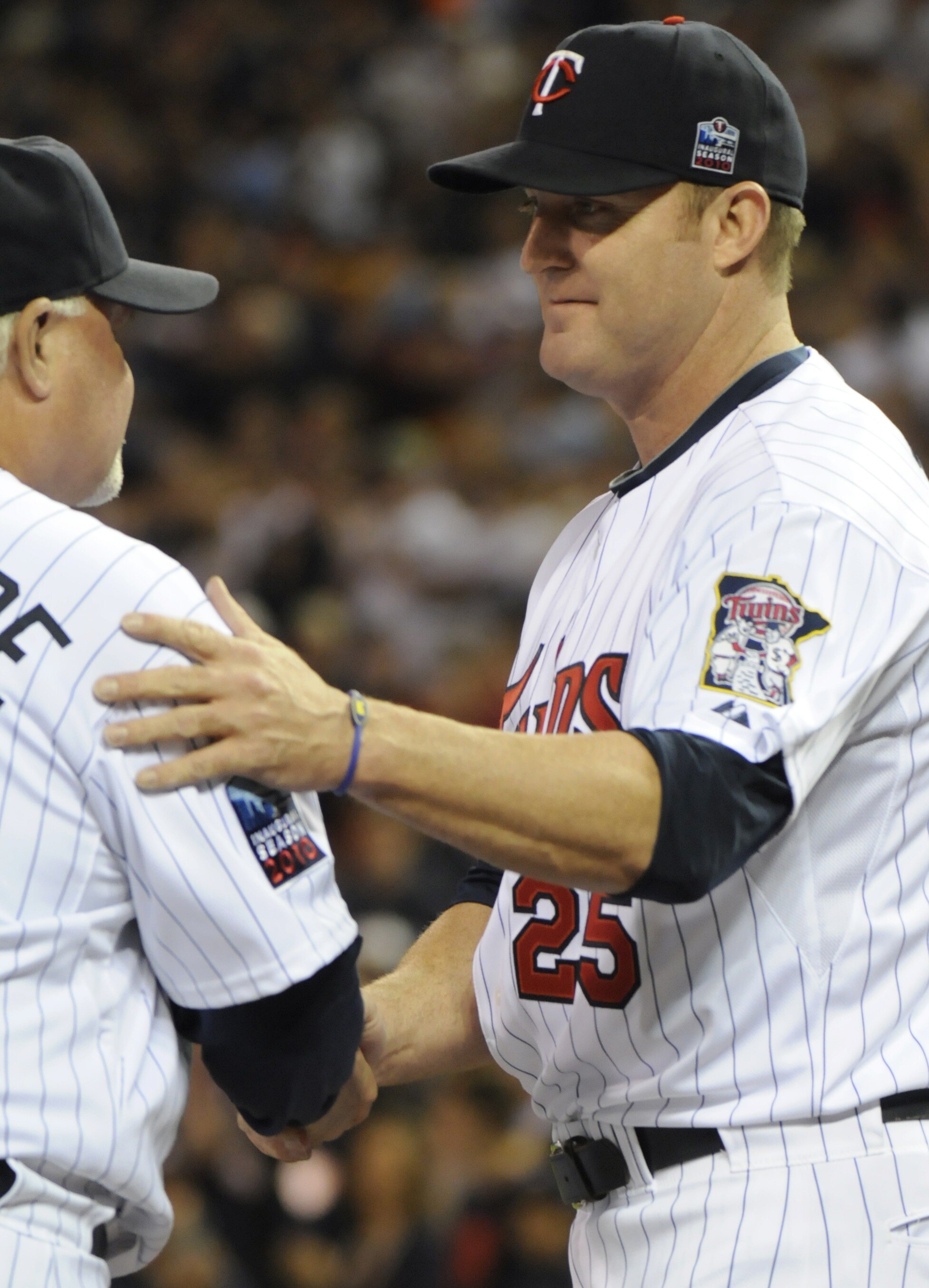 MINNEAPOLIS, MN - OCTOBER 6: Jim Thome #25 of the Minnesota Twins shakes hands with manager Ron Gardenhire #35 prior to game one of the ALDS game against New York Yankees on October 6, 2010 at Target Field in Minneapolis, Minnesota. (Photo by Hannah Fosli