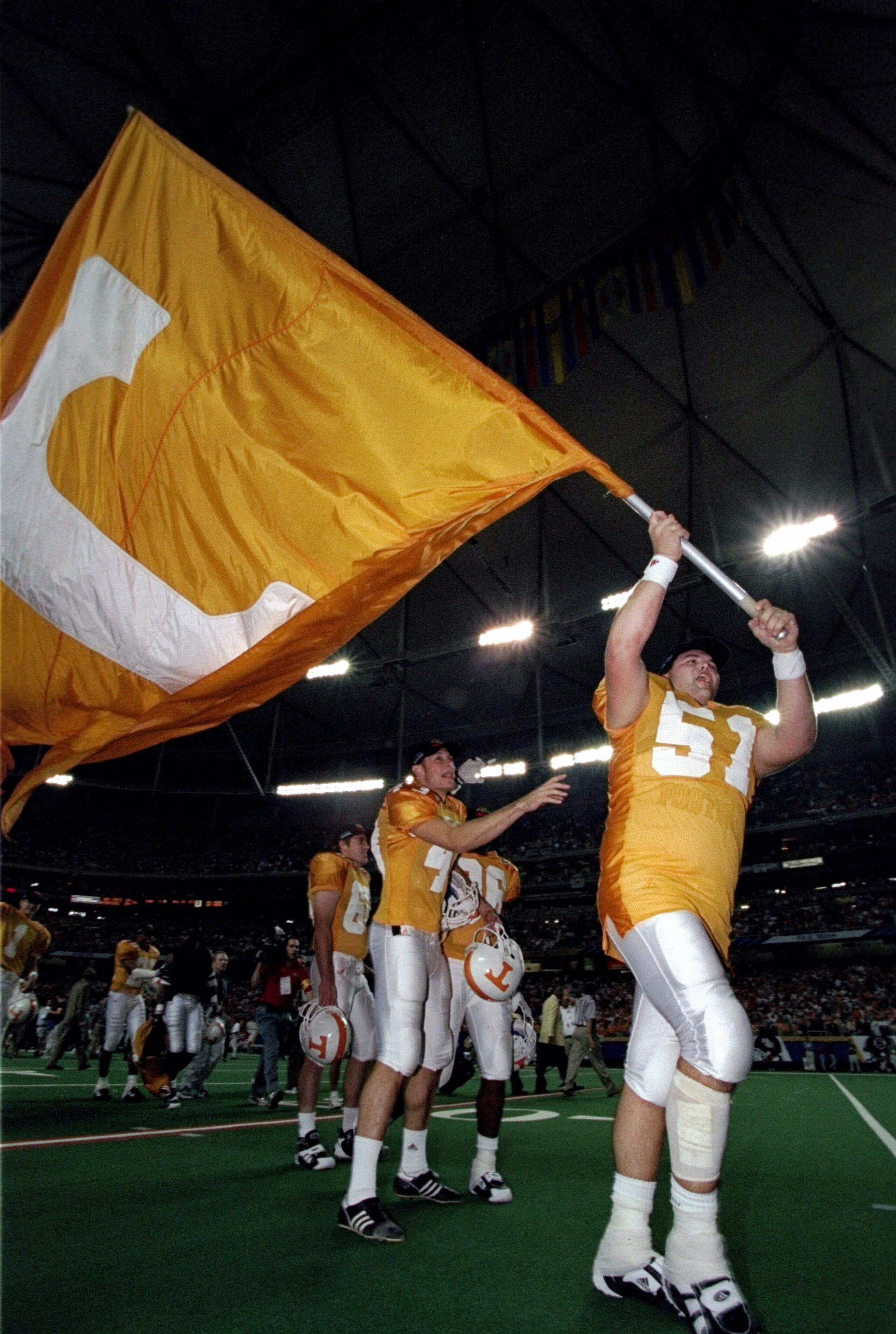5 Dec 1998: Kevin Gregory #51 of the Tennessse Volunteers marches with a flag during the SEC Championships against the Mississippi State Bulldogs at the Georgia Dome in Athens, Georgia. Tennessee defeated Mississippi St. 24-14. 5 Dec 1998: Kevin Gregory #51 of the Tennessse Volunteers marches with a flag during the SEC Championships against the Mississippi State Bulldogs at the Georgia Dome in Athens, Georgia. Tennessee defeated Mississippi St. 24-14.
