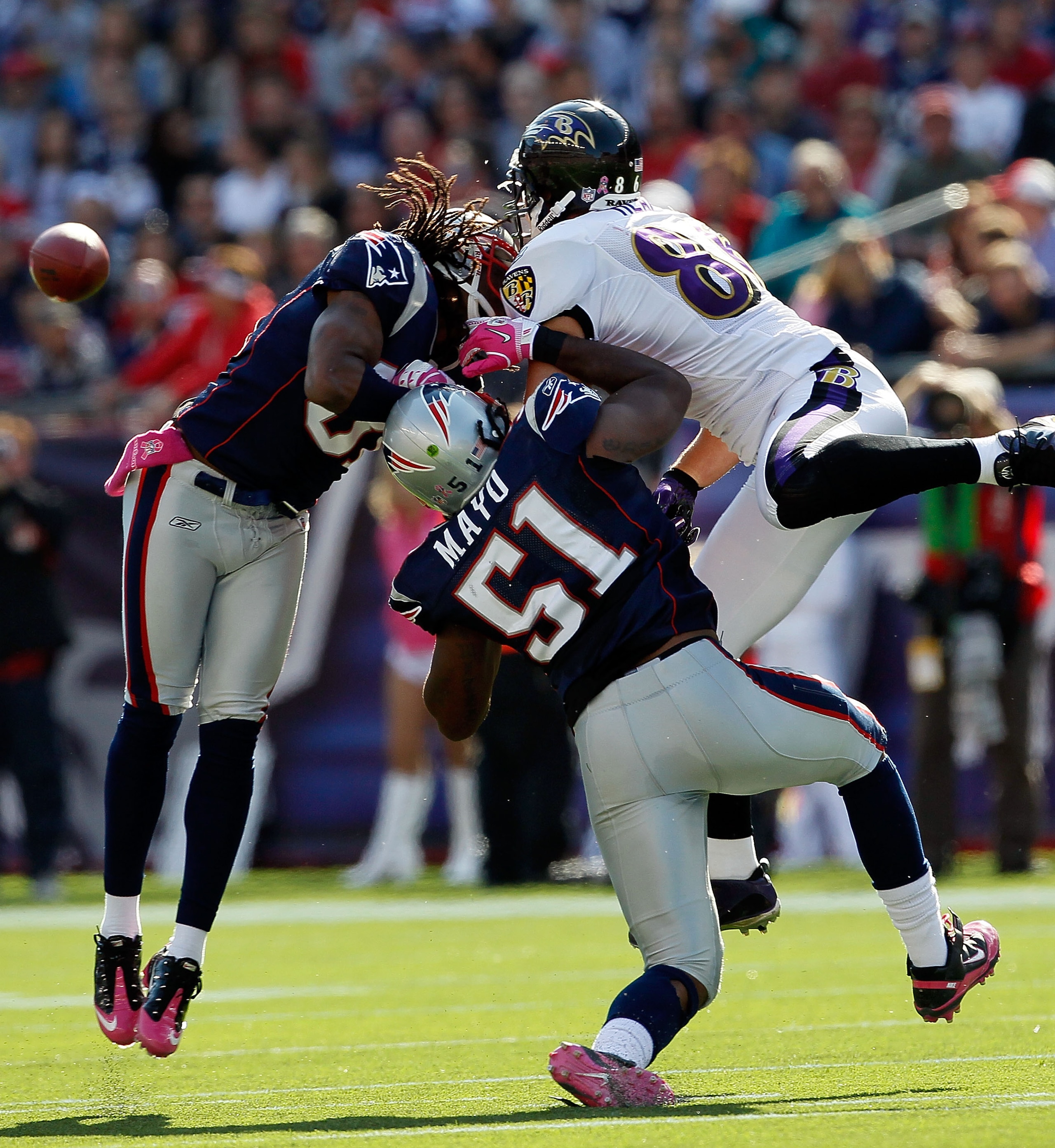 FOXBORO, MA - OCTOBER 17: Brandon Meriweather #31 of the New England Patriots collides with Todd Heap #86 of the Baltimore Ravens after Heap was hit by Jerod Mayo #51, also of the Patriots at Gillette Stadium on October 17, 2010 in Foxboro, Massachusetts.