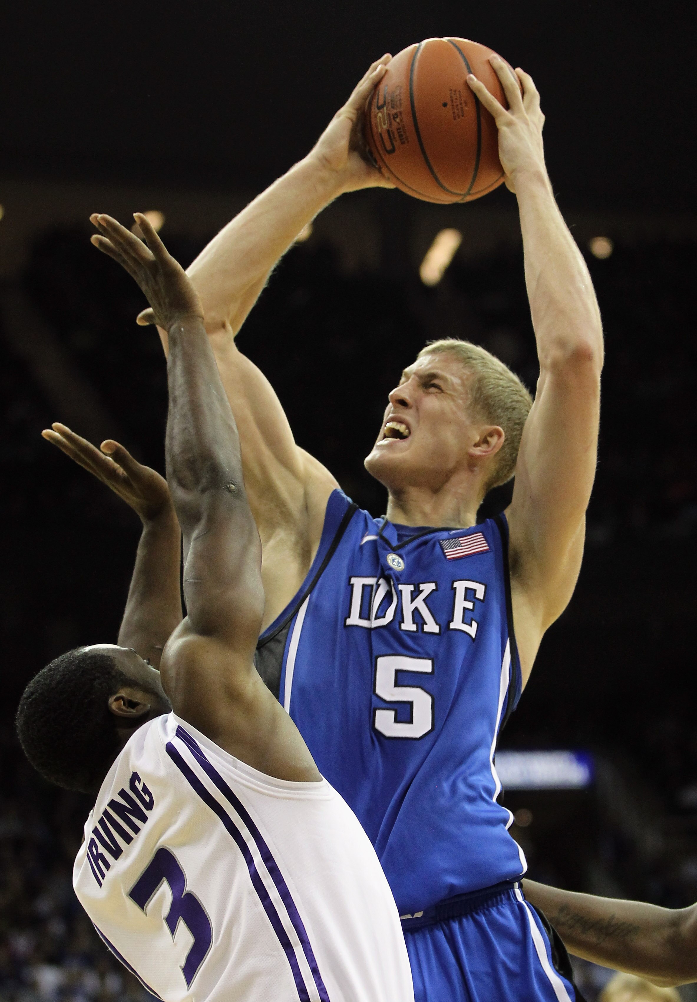KANSAS CITY, MO - NOVEMBER 23:  Mason Plumlee #5 of the Duke Blue Devils shoots over Martavious Irving #3 of the Kansas State Wildcats during the CBE Classic championship game on November 23, 2010 at the Sprint Center in Kansas City, Missouri.  (Photo by 