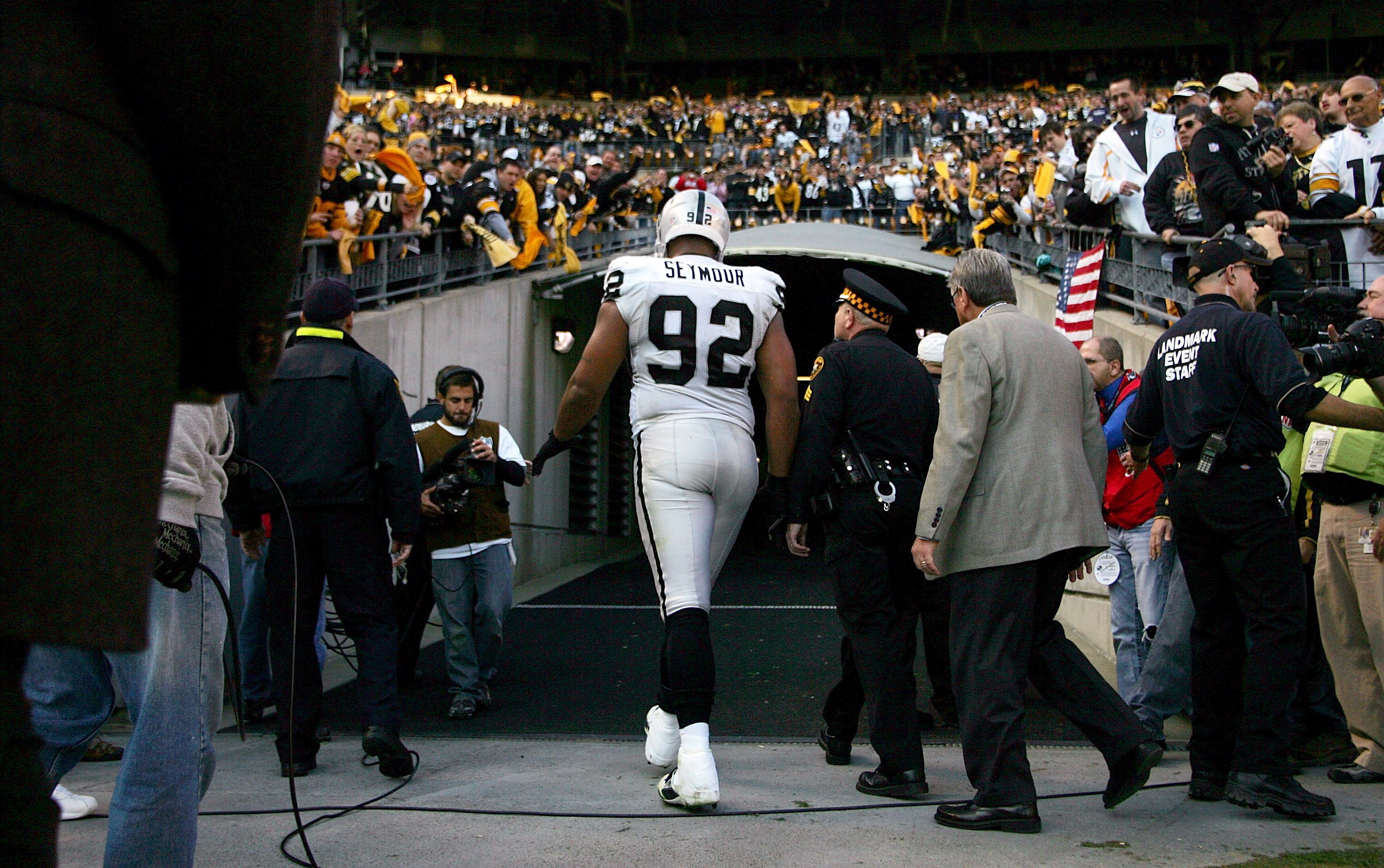 PITTSBURGH, PA - NOVEMBER 21:  Richard Seymour #92 of the Oakland Raiders is escorted out of the stadium after being ejected for hitting Ben Roethlisberger #7 of the Pittsburgh Steelers during the game on November 21, 2010 at Heinz Field in Pittsburgh, Pe
