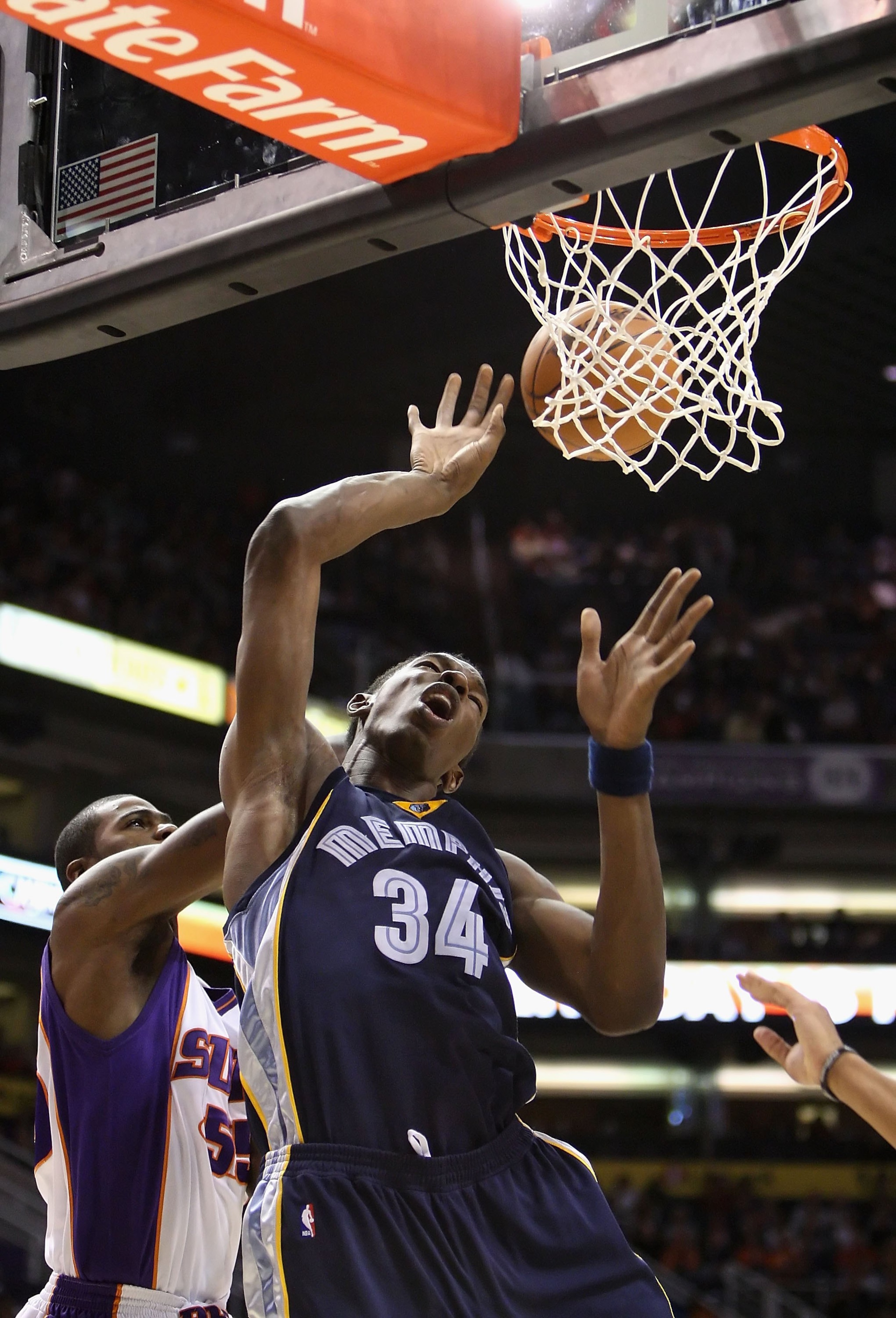 PHOENIX - NOVEMBER 25:  Hasheem Thabeet #34 of the Memphis Grizzlies is fouled as he puts up a shot during the NBA game against the Phoenix Suns at US Airways Center on November 25, 2009 in Phoenix, Arizona.  The Suns defeated the Grizzlies 126-111.  NOTE