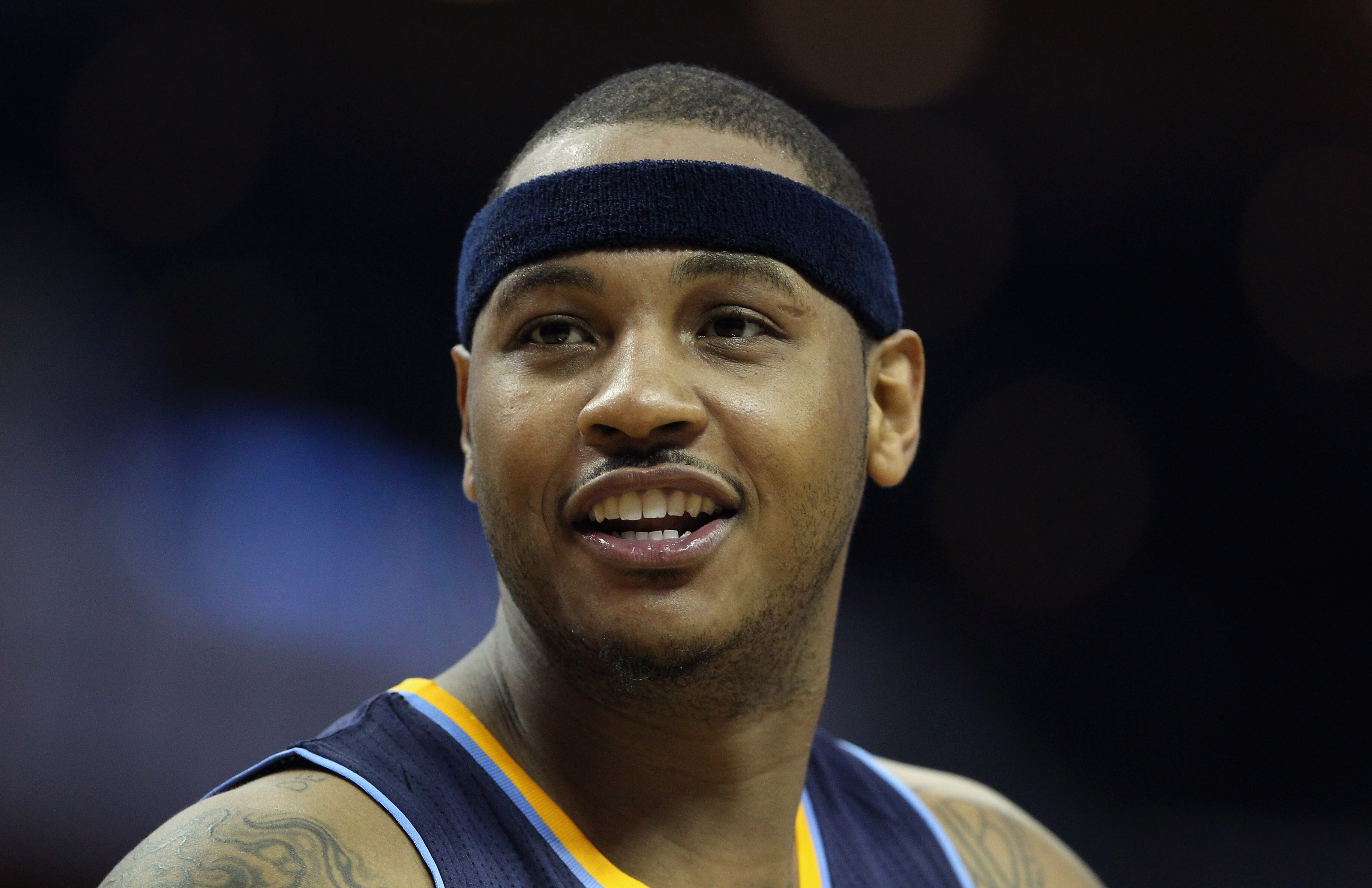 CHARLOTTE, NC - DECEMBER 07:  Carmelo Anthony #15 of the Denver Nuggets watches on against the Charlotte Bobcats during their game at Time Warner Cable Arena on December 7, 2010 in Charlotte, North Carolina.  NOTE TO USER: User expressly acknowledges and