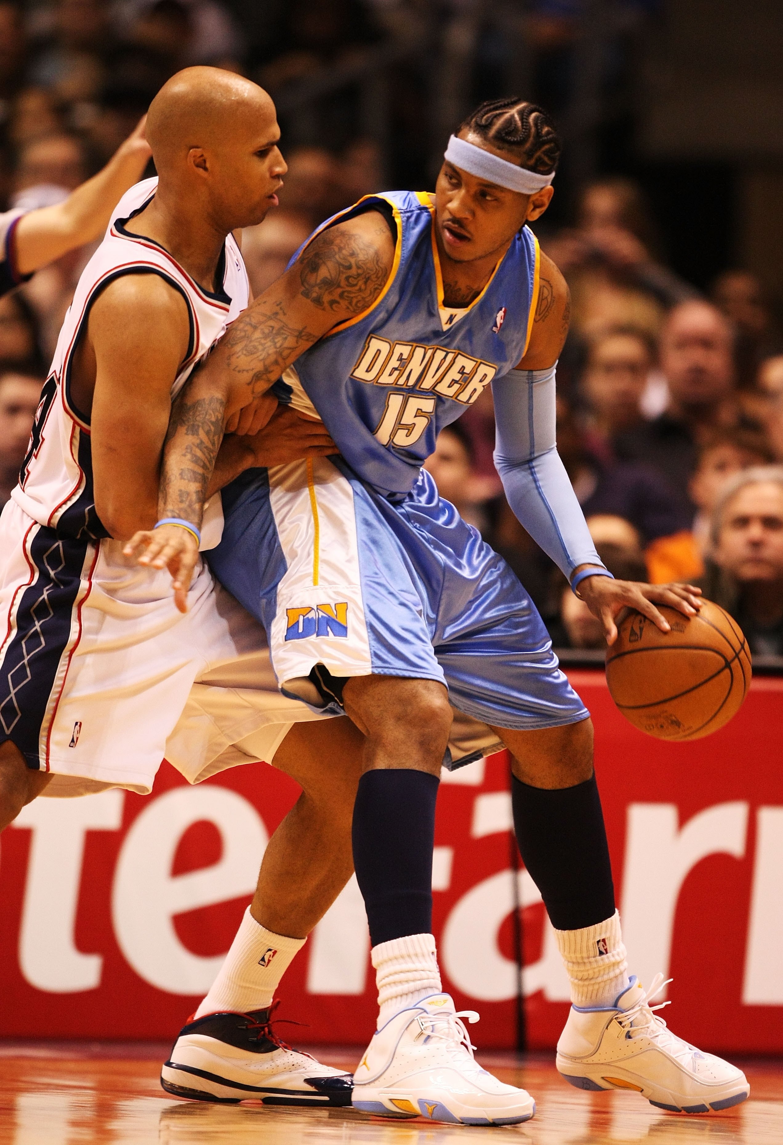 EAST RUTHERFORD, NJ - MARCH 21:  Carmelo Anthony #15 of the Denver Nuggets dribbles against Richard Jefferson #24 of the New Jersey Nets during their game on March 21, 2008 at the Izod Arena in East Rutherford, New Jersey.  Photo By Al Bello/Getty Images.
