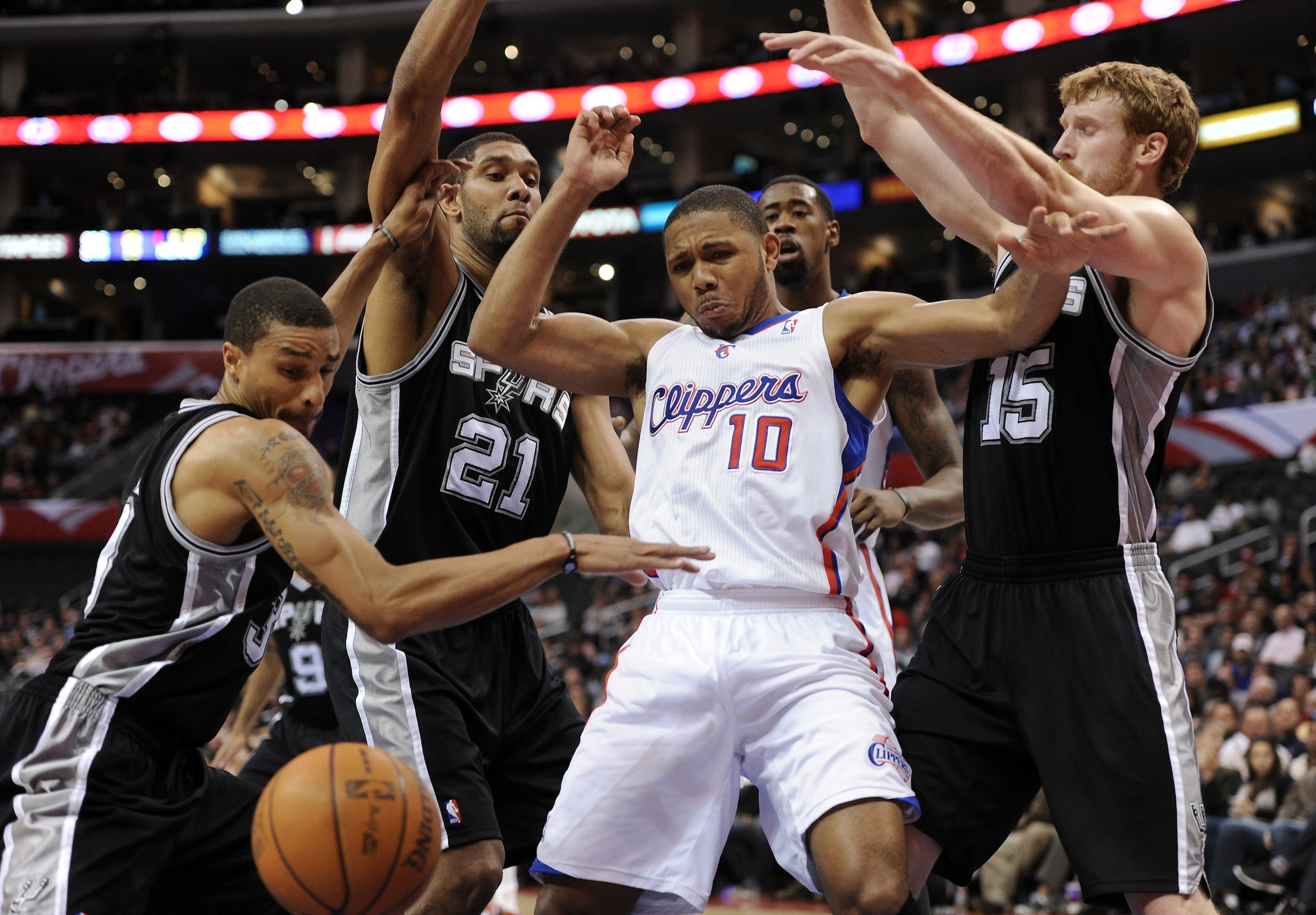 LOS ANGELES, CA - DECEMBER 01: Eric Gordon #10 of the Los Angeles Clippers has the ball knocked away by Tim Duncan #21, Matt Bonner #15 and George Hill #3 of the San Antonio Spurs Los Angeles at the Staples Center on December 1, 2010 in Los Angeles, Cali LOS ANGELES, CA - DECEMBER 01: Eric Gordon #10 of the Los Angeles Clippers has the ball knocked away by Tim Duncan #21, Matt Bonner #15 and George Hill #3 of the San Antonio Spurs Los Angeles at the Staples Center on December 1, 2010 in Los Angeles, Cali