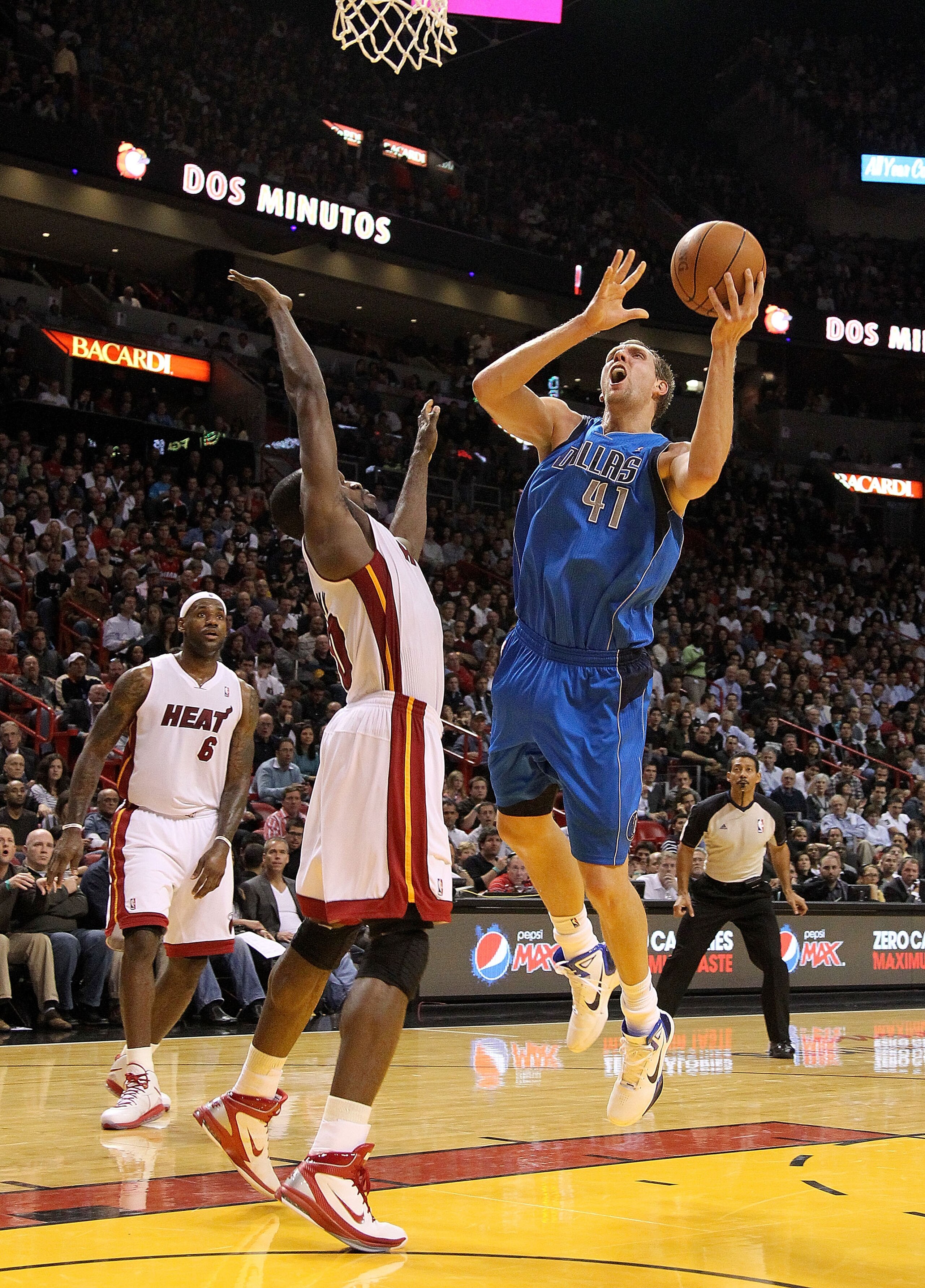 MIAMI, FL - DECEMBER 20: Dirk Nowitzki #41 of the Dallas Mavericks shoots over Joel Anthony #50 of the Miami Heat during a game at American Airlines Arena on December 20, 2010 in Miami, Florida. NOTE TO USER: User expressly acknowledges and agrees that, MIAMI, FL - DECEMBER 20: Dirk Nowitzki #41 of the Dallas Mavericks shoots over Joel Anthony #50 of the Miami Heat during a game at American Airlines Arena on December 20, 2010 in Miami, Florida. NOTE TO USER: User expressly acknowledges and agrees that,