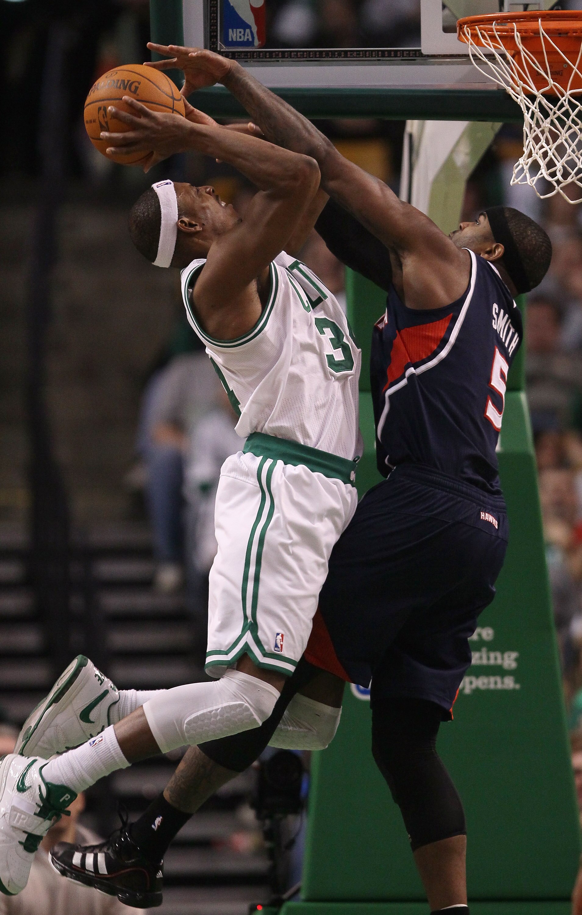 BOSTON, MA - DECEMBER 16:  Paul Pierce #34 of the Boston Celtics is fouled by Josh Smith #5 of the Atlanta Hawks on December 16, 2010 at the TD Garden in Boston, Massachusetts. The Celtics defeated the Hawks 102-90. NOTE TO USER: User expressly acknowledg