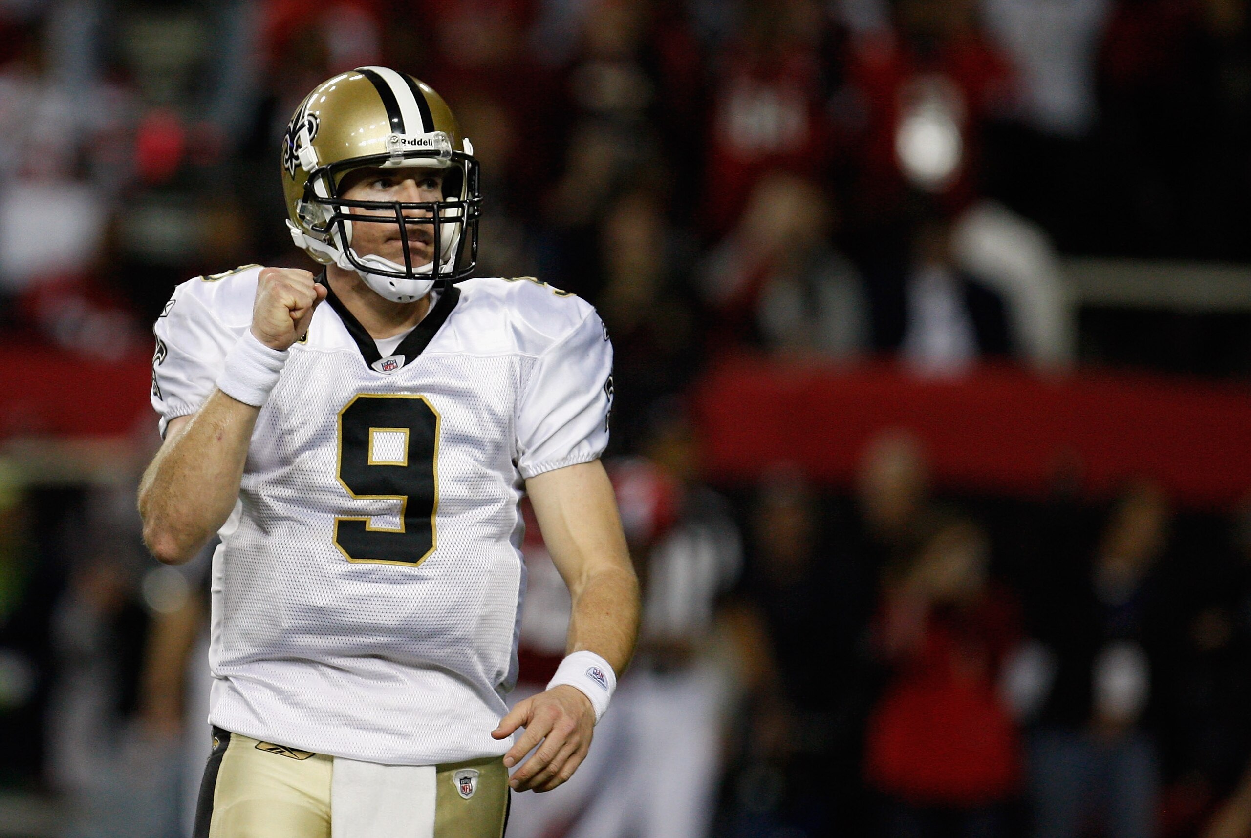 ATLANTA, GA - DECEMBER 27:  Quarterback Drew Brees #9 of the New Orleans Saints celebrates a touchdown pass to Jimmy Graham in the second half during the game against the Atlanta Falcons at the Georgia Dome on December 27, 2010 in Atlanta, Georgia.  (Phot