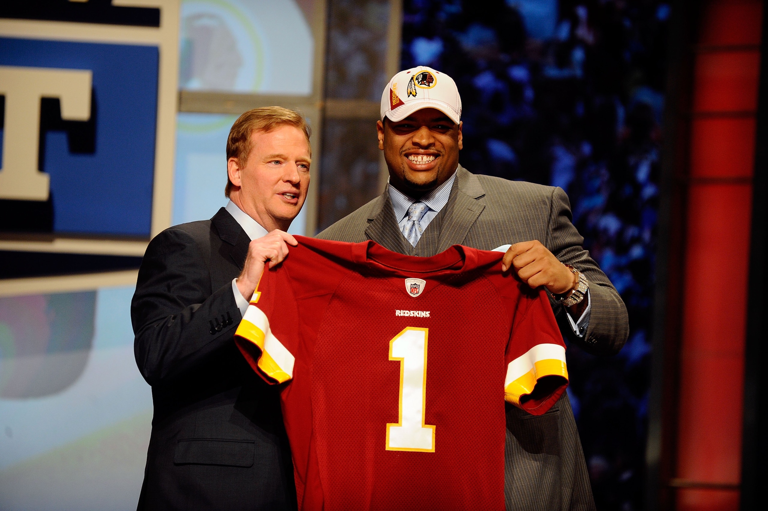 NEW YORK - APRIL 22:  Trent Williams from the Oklahoma Sooners poses with NFL Commissioner ROger Goodell as they hold a Washington Redskins jersey after Washington selected Williams number 4 overall during the first round of the 2010 NFL Draft at Radio Ci