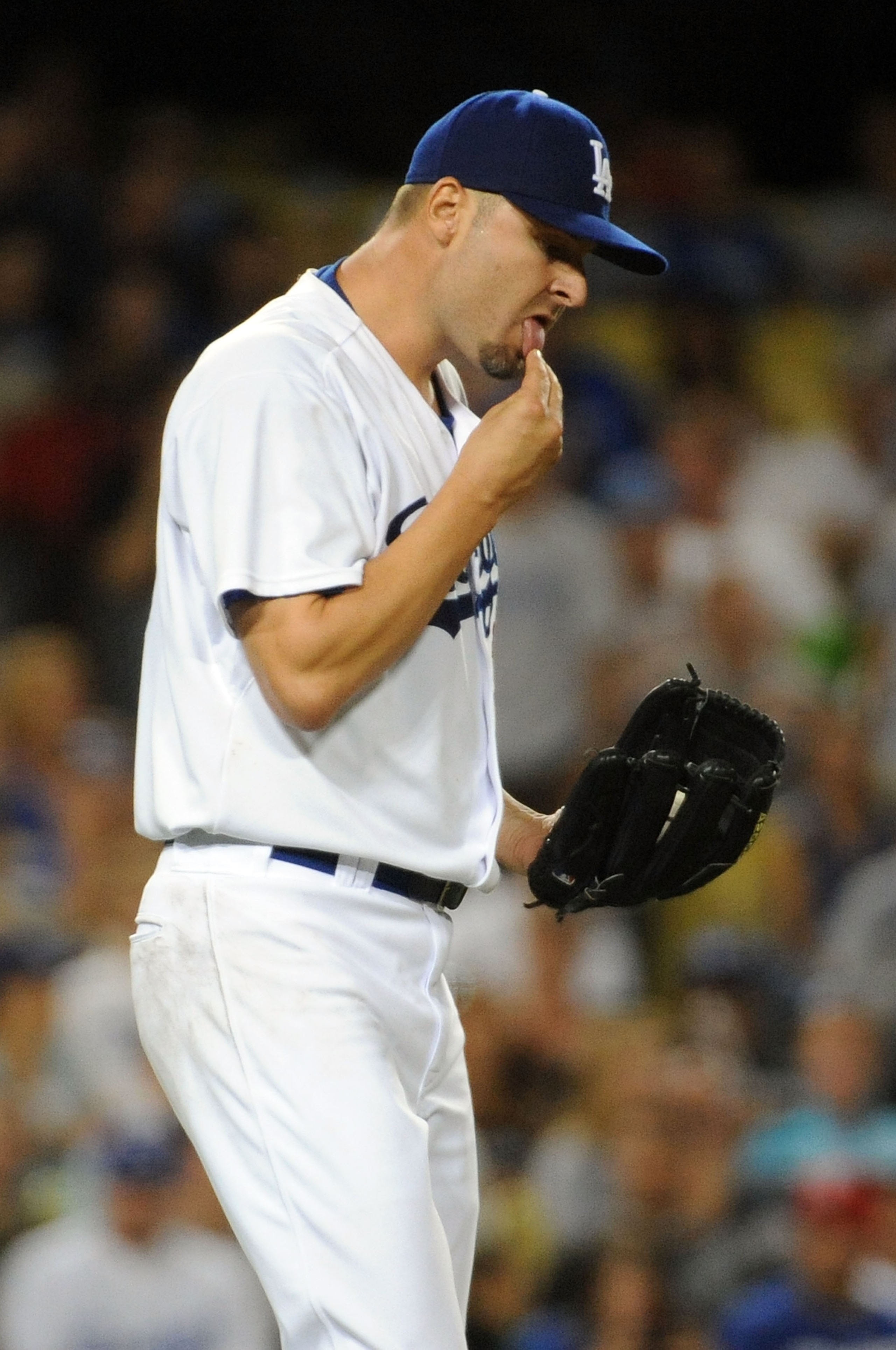 LOS ANGELES, CA - AUGUST 5: Jason Schmidt #29 of the Los Angeles Dodgers reacts after hitting Craig Counsell #30 of the Milwaukee Brewers in the fourth inning at Dodger Stadium August 5, 2009 in Los Angeles, California. (Photo by Harry How/Getty Images) LOS ANGELES, CA - AUGUST 5: Jason Schmidt #29 of the Los Angeles Dodgers reacts after hitting Craig Counsell #30 of the Milwaukee Brewers in the fourth inning at Dodger Stadium August 5, 2009 in Los Angeles, California. (Photo by Harry How/Getty Images)