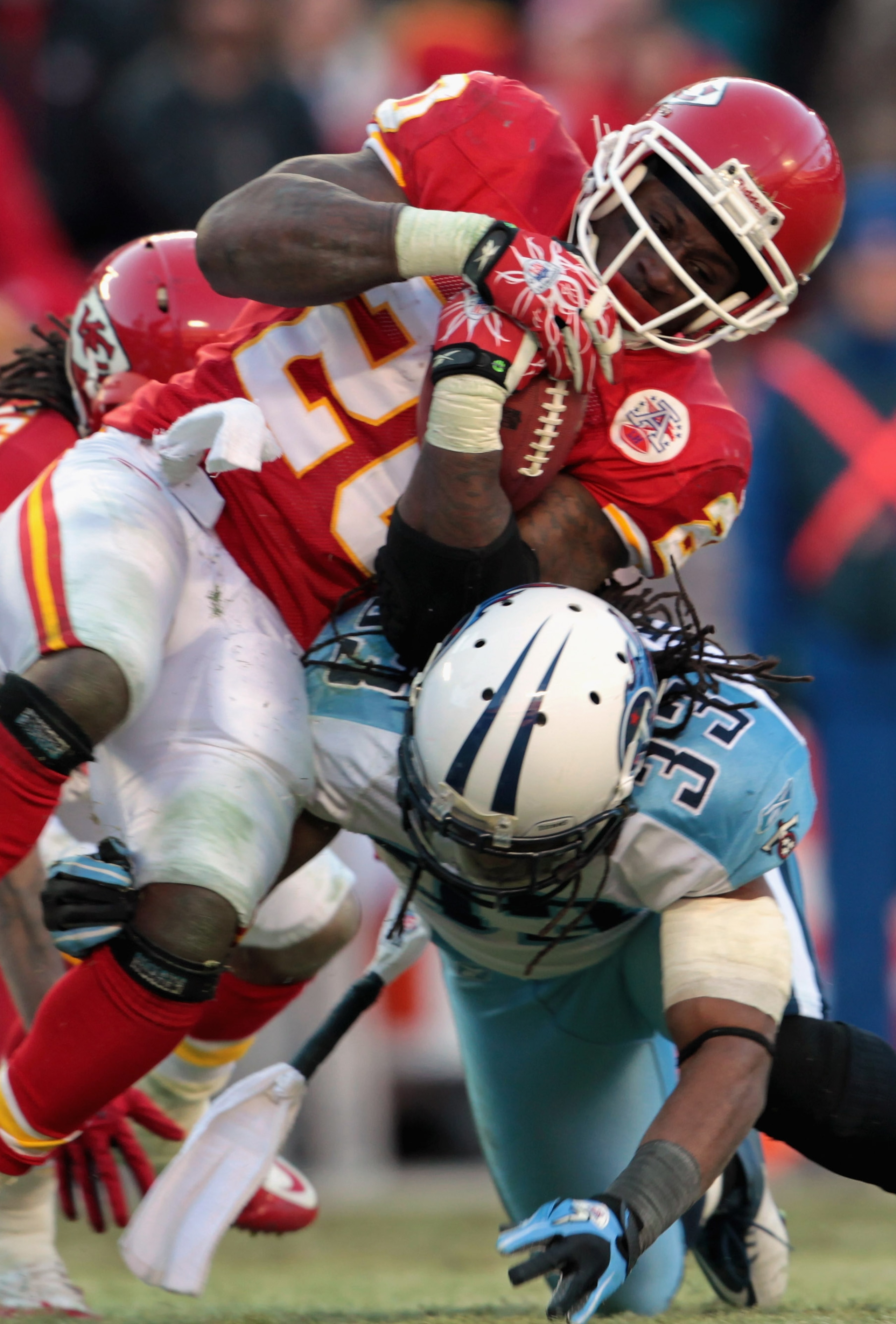 KANSAS CITY, MO - DECEMBER 26:  Thomas Jones #20 of the Kansas City Chiefs carries the ball as Michael Griffin #33 of the Tennessee Titans defends during the game on December 26, 2010 at Arrowhead Stadium in Kansas City, Missouri.  (Photo by Jamie Squire/