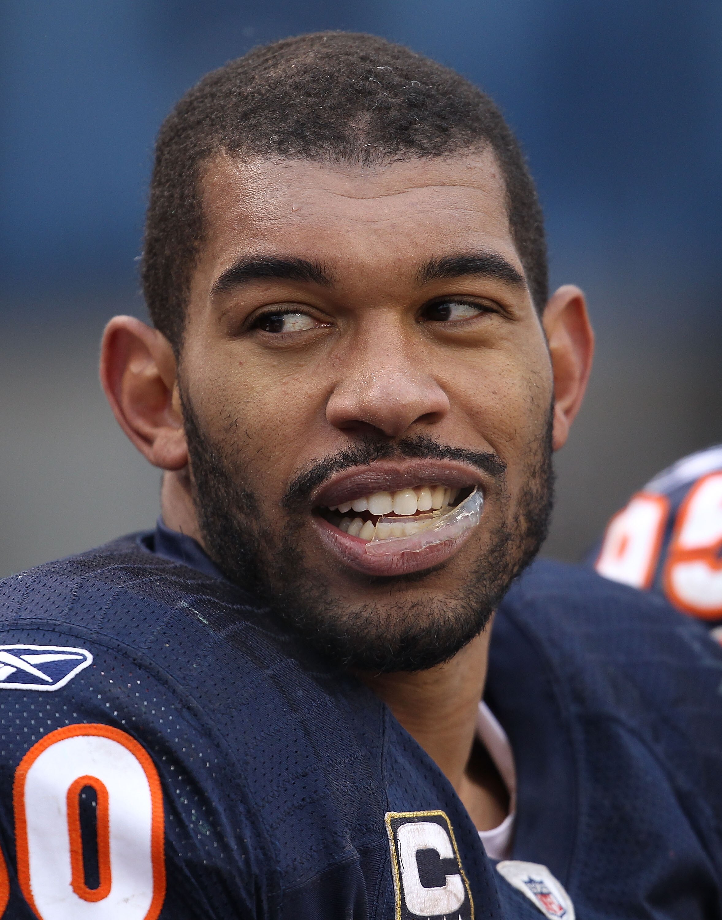 CHICAGO, IL - DECEMBER 26: Julius Peppers #90 of the Chicago Bears talks with a teammate on the bench during a game against the New York Jets at Soldier Field on December 26, 2010 in Chicago, Illinois. The Bears defeated the Jets 38-34. (Photo by Jonathan