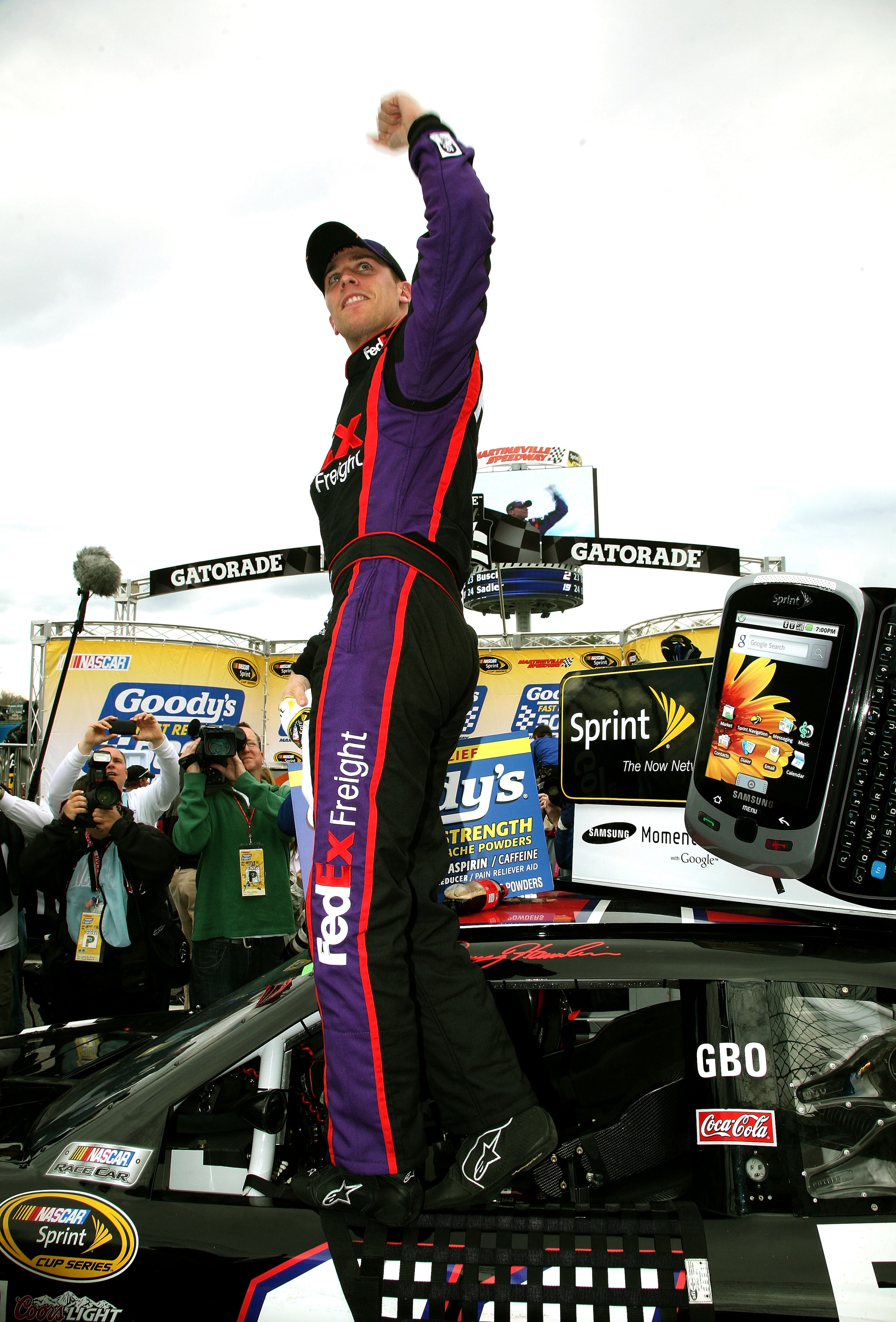 MARTINSVILLE, VA - MARCH 29:  Denny Hamlin celebrates in victory lane after driving the #11 FedEx Toyota to a win in the NASCAR Sprint Cup Series Goody's Fast Pain Relief 500 at Martinsville Speedway on March 29, 2010 in Martinsville, Virginia.  (Photo by