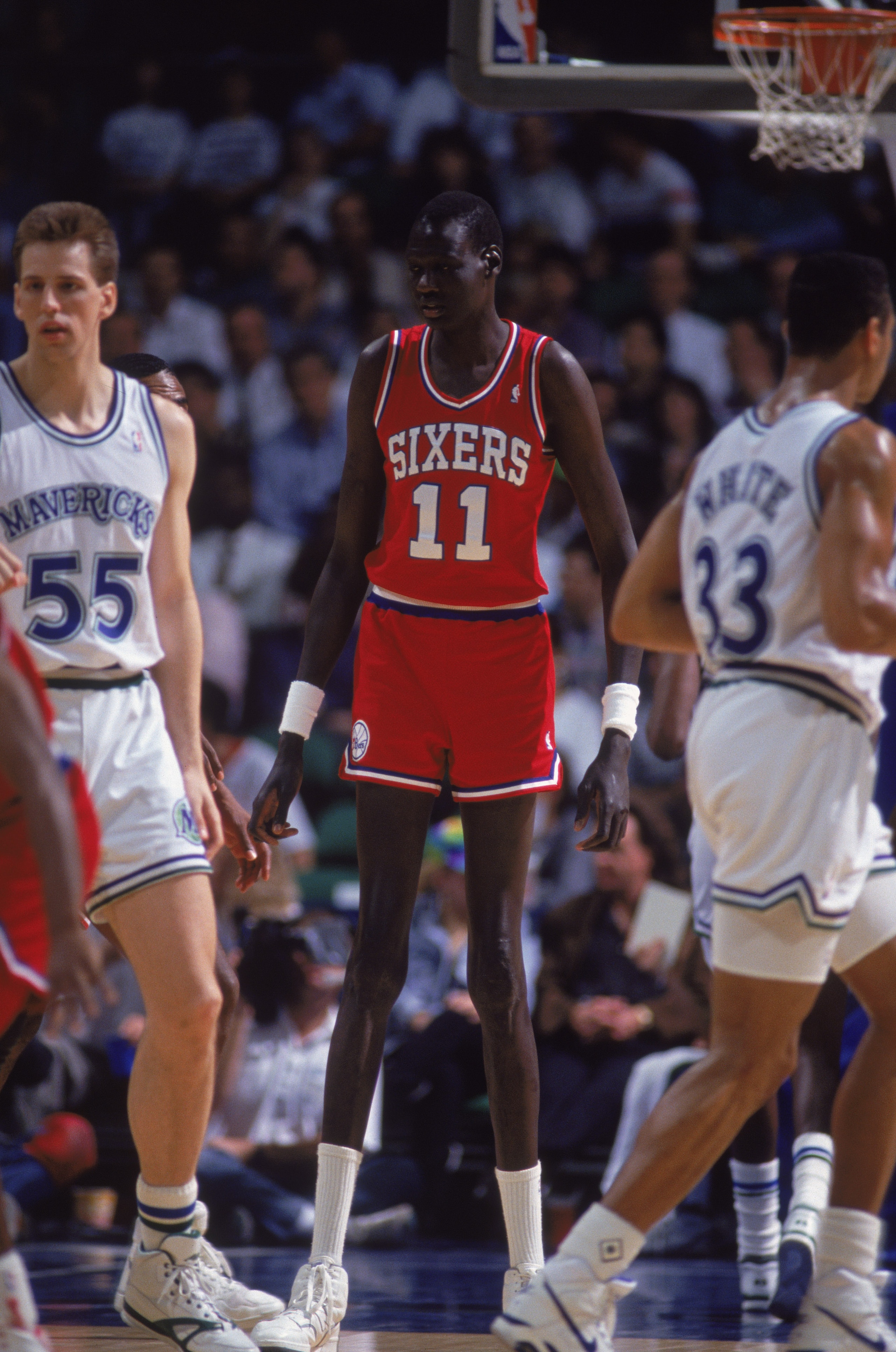 1990:  Manute Bol #11 of the Philadelphia 76ers moves on the floor during the game against the Dallas Mavericks NOTE TO USER: User expressly acknowledges and agrees that, by downloading and/or using this Photograph, User is consenting to the terms and con
