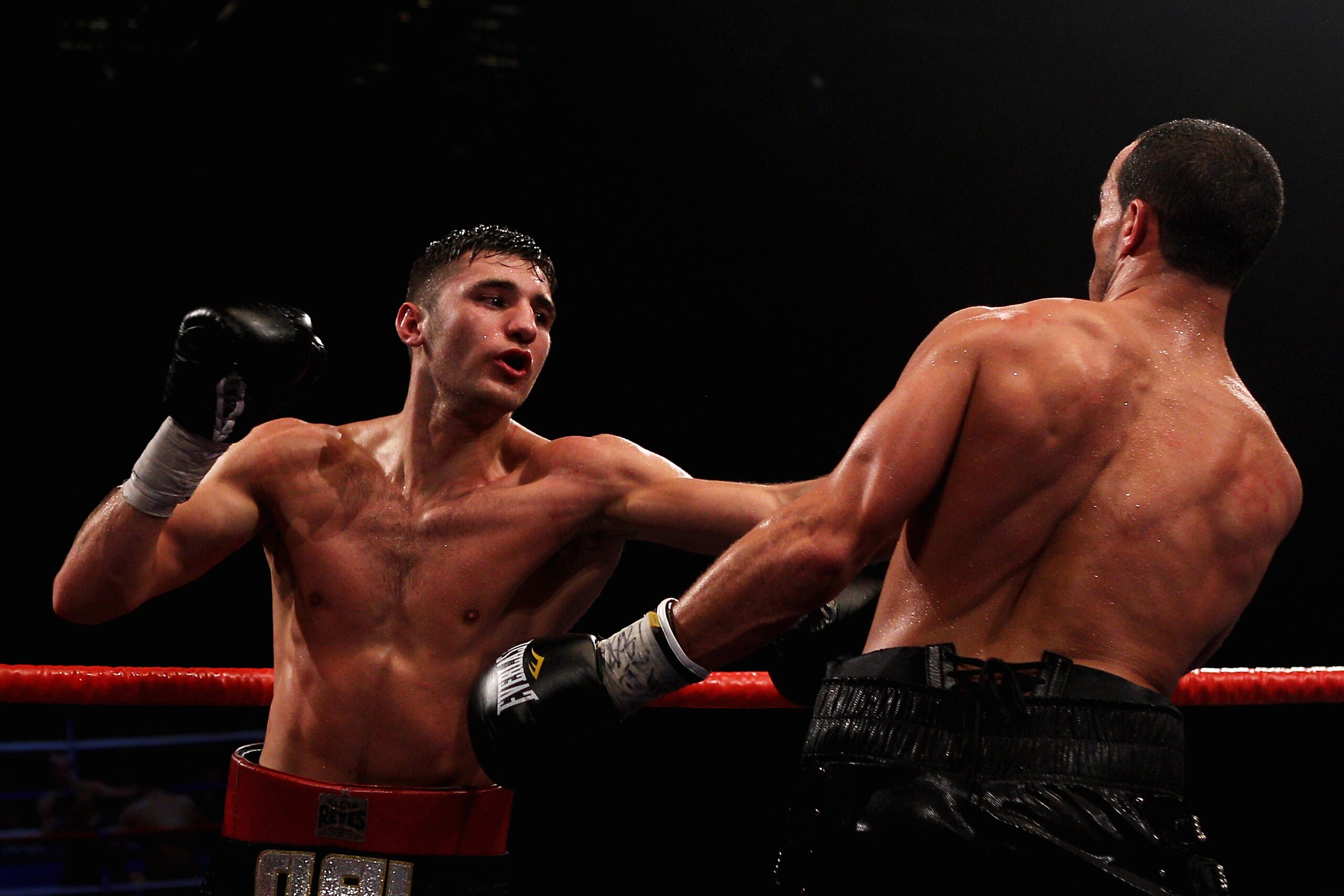 LIVERPOOL, ENGLAND - DECEMBER 11:  Nathan Cleverly of Wales lands a punch on Nadjib Mohammedi of France during their Interm Light Heavy weight Championship of the world bout at the Frank Warren 30 Years anniversary show at Echo Arena on December 11, 2010