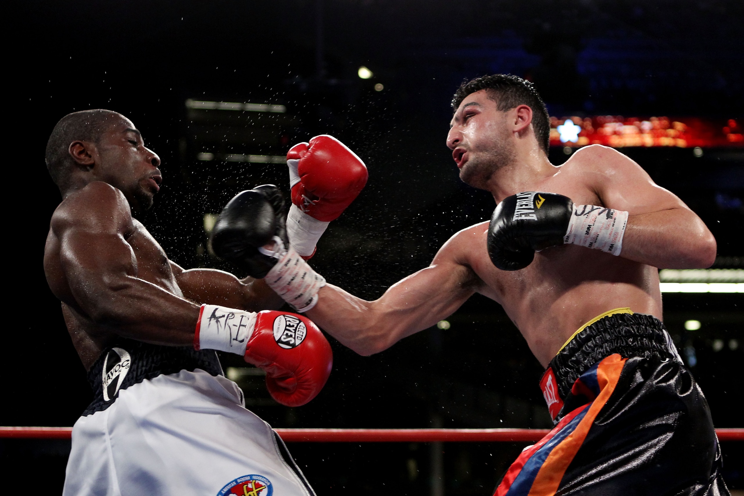 NEW YORK - JUNE 05:  Vanes Martirosyan (R) throws a right to the face of Joe Greene during the NABF & NABO super welterweight fight on June 5, 2010 at Yankee Stadium in the Bronx borough of New York City. Matirosyan wins by unanimous decision 96-93, 96-93