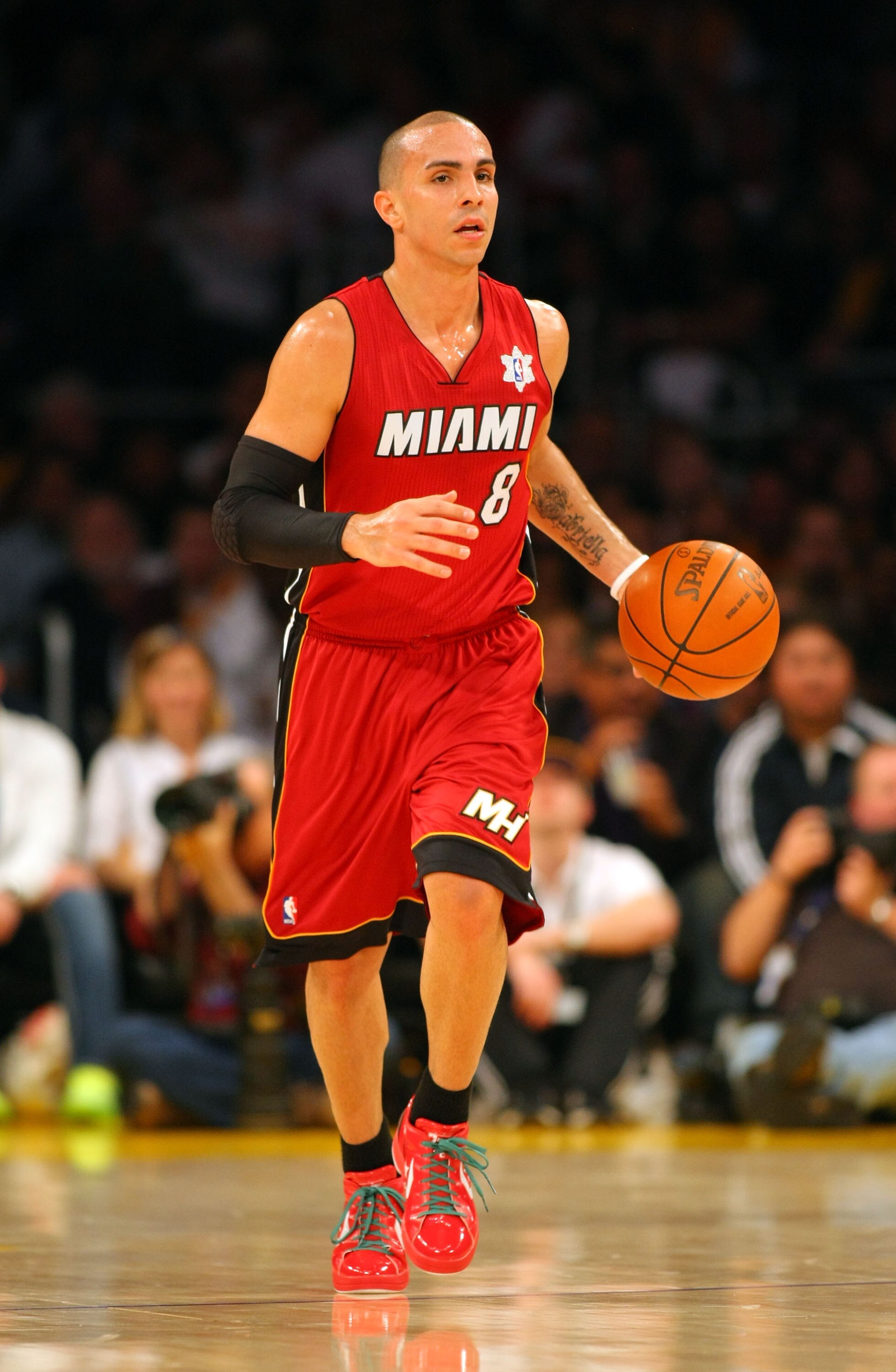 LOS ANGELES, CA - DECEMBER 25:  Carlos Arroyo #8 of the Miami Heat dribbles the ball upcourt during the NBA game against the Los Angeles Lakers at Staples Center on December 25, 2010 in Los Angeles, California. The Heat defeated the Lakers 96-80. NOTE TO