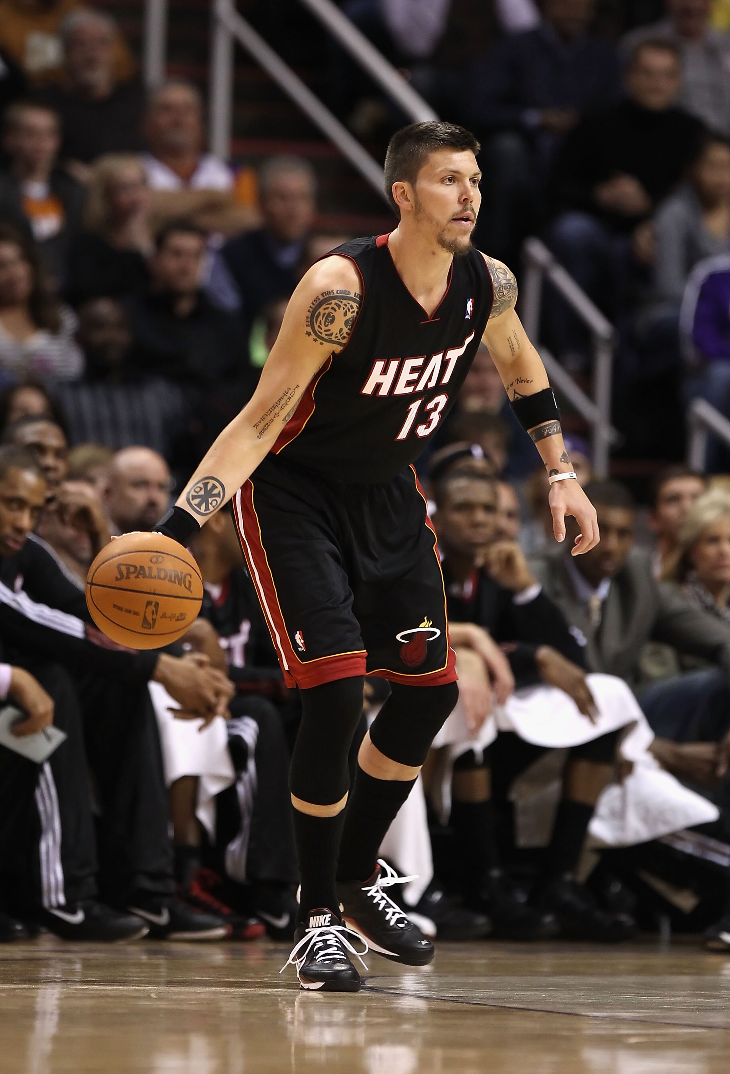 PHOENIX - DECEMBER 23:  Mike Miller #13 of the Miami Heat handles the ball during the NBA game against the Phoenix Suns at US Airways Center on December 23, 2010 in Phoenix, Arizona. NOTE TO USER: User expressly acknowledges and agrees that, by downloadin