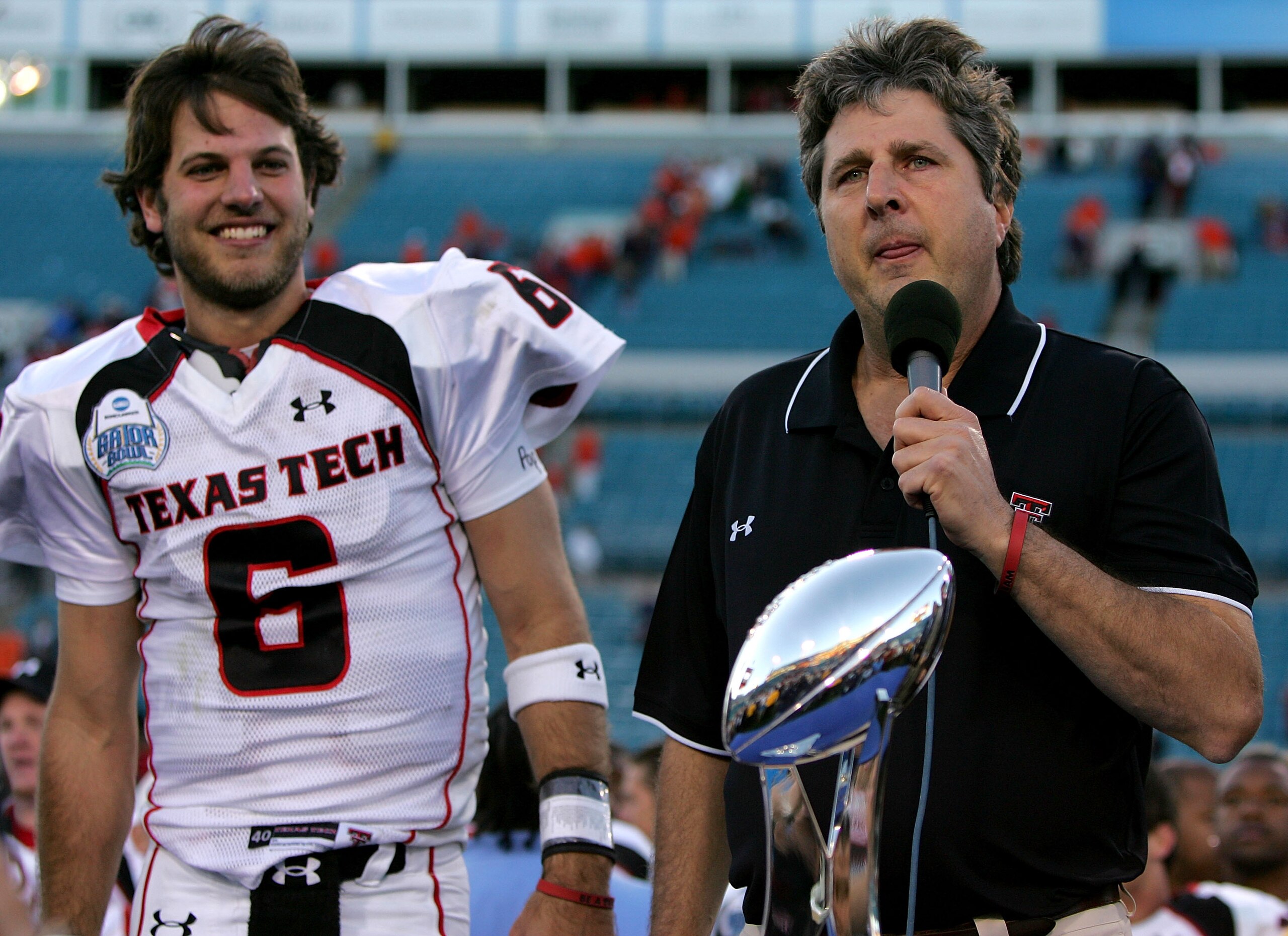 JACKSONVILLE, FL - JANUARY 01: Coach Mike Leach and Graham Harrell #6 of the Texas Tech Red Raiders speak to the crowd during the trophy presentation following Gator Bowl against the Virginia Cavaliers at Jacksonville Municipal Stadium on January 1, 2008