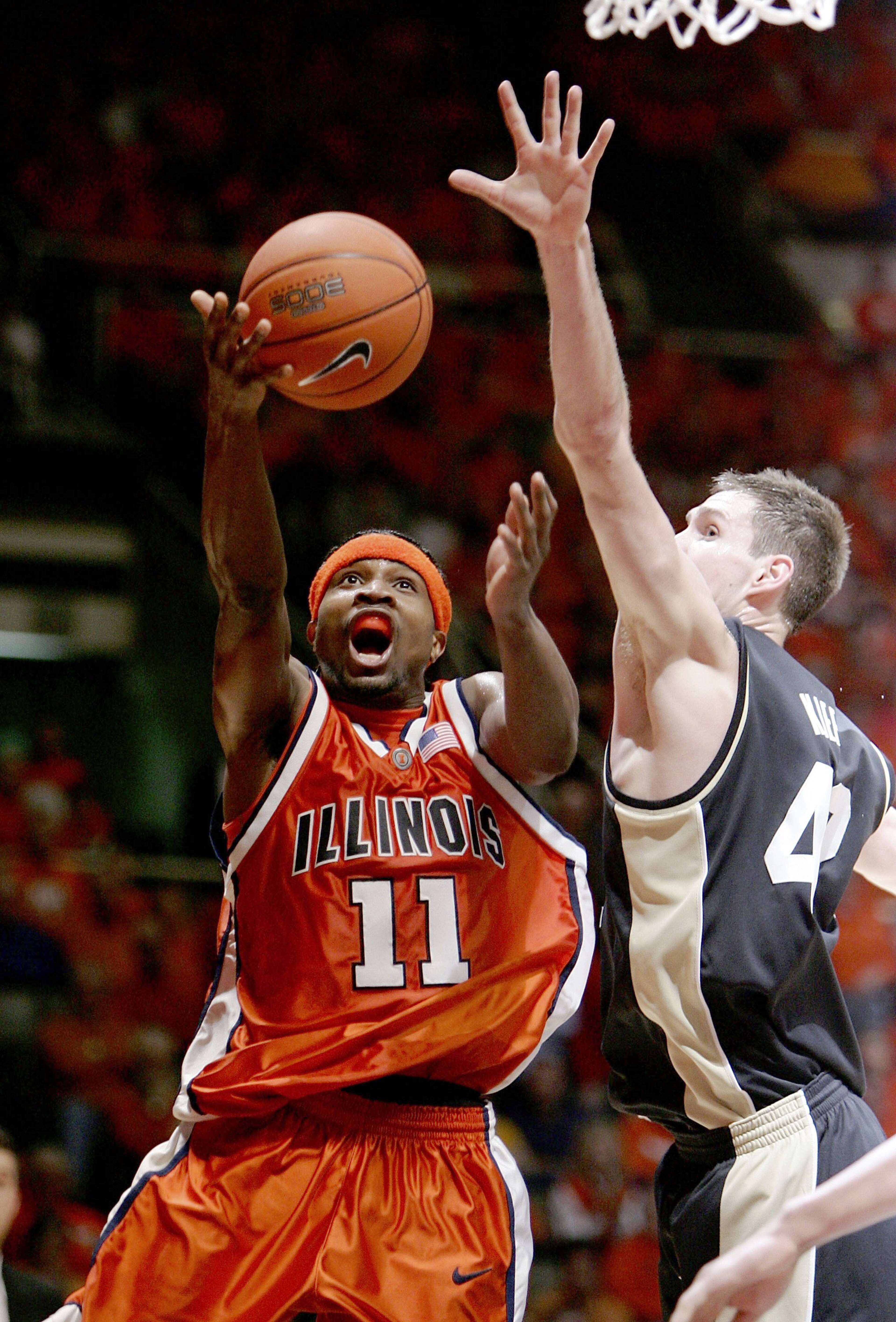 CHAMPAIGN, IL - JANUARY 28: Dee Brown #11 of the Illinois Fighting Illini puts up a shot against Matt Kiefer #42 of the Purdue Boilermakers on January 28, 2006 at the Assembly Hall at the University of Illinois in Champaign, Illinois. Illinois defeated P CHAMPAIGN, IL - JANUARY 28: Dee Brown #11 of the Illinois Fighting Illini puts up a shot against Matt Kiefer #42 of the Purdue Boilermakers on January 28, 2006 at the Assembly Hall at the University of Illinois in Champaign, Illinois. Illinois defeated P