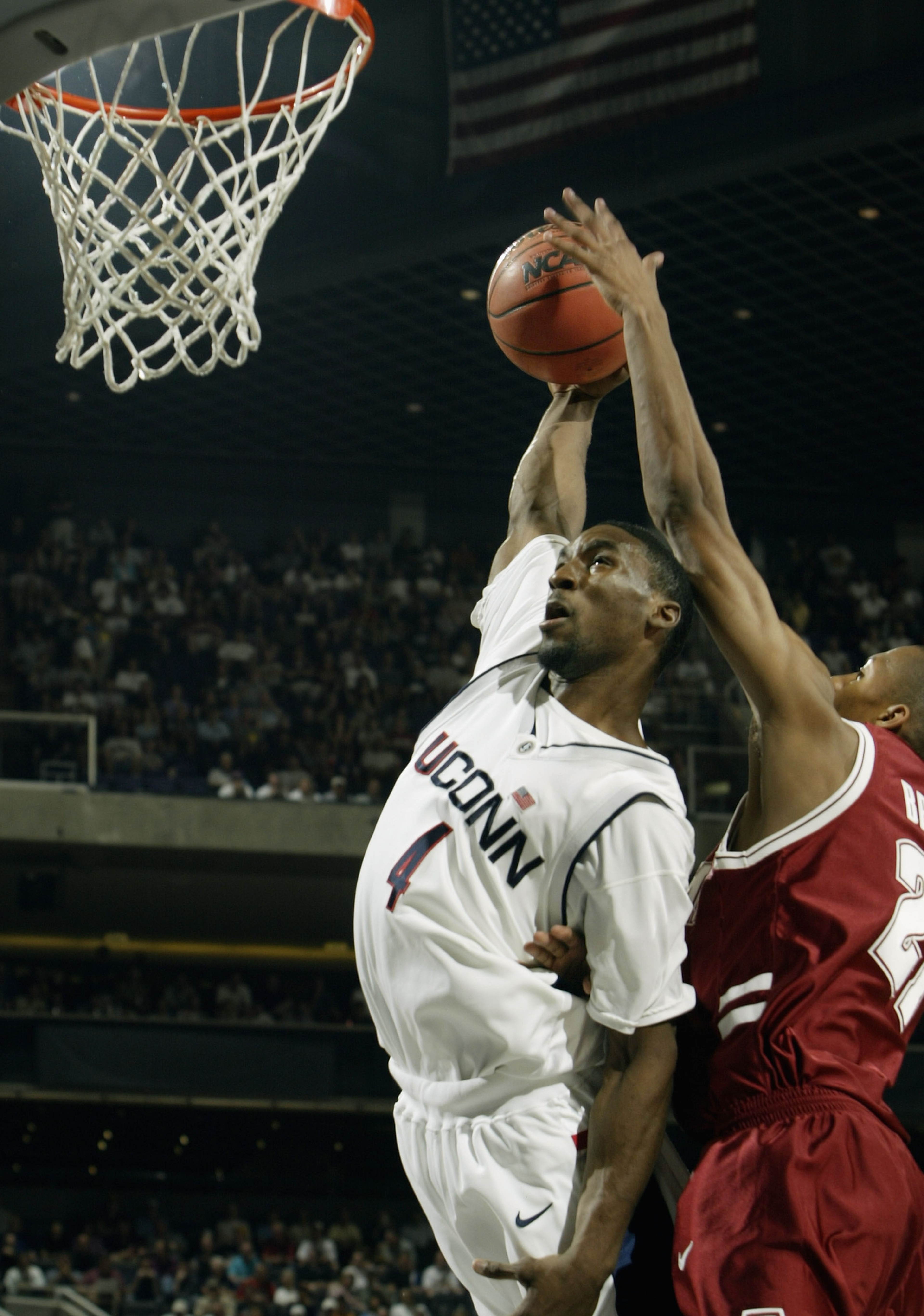 PHOENIX - MARCH 27: Ben Gordon #4 of the University of Connecticut Huskies goes up for a dunk against Evan Brock #21 of the Alabama Crimson Tide during the fourth round game of the NCAA Division I Men's Basketball Tournament at America West Arena on Marc PHOENIX - MARCH 27: Ben Gordon #4 of the University of Connecticut Huskies goes up for a dunk against Evan Brock #21 of the Alabama Crimson Tide during the fourth round game of the NCAA Division I Men's Basketball Tournament at America West Arena on Marc