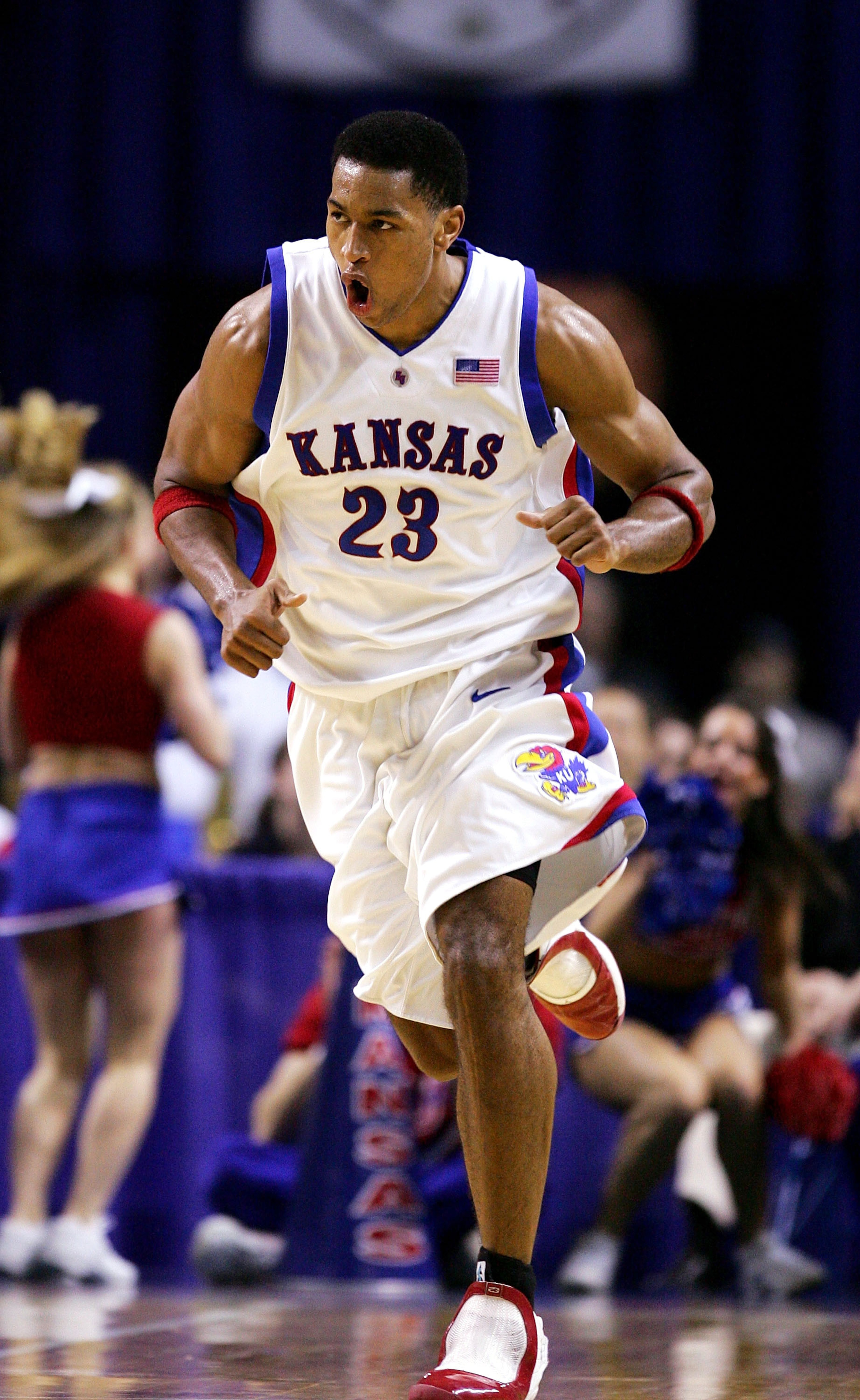 KANSAS CITY, MO - MARCH 11: Wayne Simien #23 of the Kansas Jayhawks is excited as he runs back on defense in the second half against the Kansas State Wildcats in Day 2 of the Phillips 66 Big 12 Men's Basketball Tournament at Kemper Arena on March 11, 200 KANSAS CITY, MO - MARCH 11: Wayne Simien #23 of the Kansas Jayhawks is excited as he runs back on defense in the second half against the Kansas State Wildcats in Day 2 of the Phillips 66 Big 12 Men's Basketball Tournament at Kemper Arena on March 11, 200