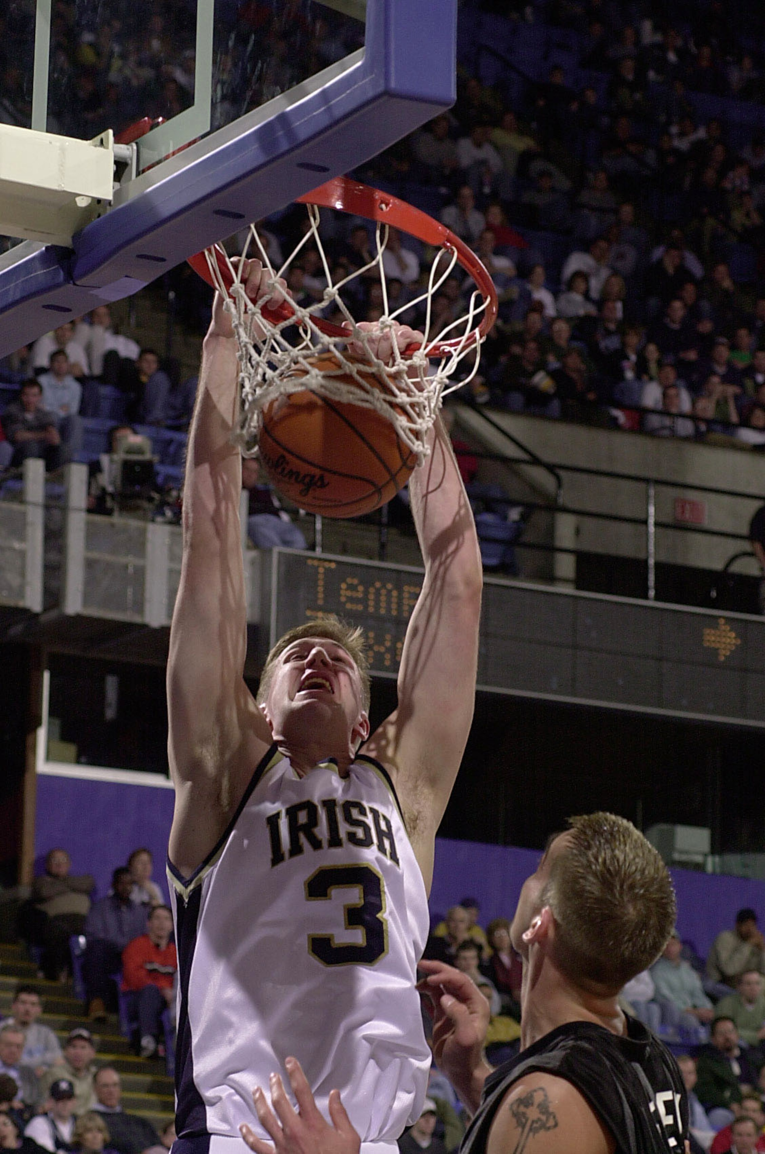 16 Mar 2001:  Troy Murphy #3 of Notre Dame dunks the ball as Kevin Frey #3 of Xavier looks on during the first round of the NCAA Men's College Basketball Championship at Kemper Arena in Kansas City, Missouri. DIGITAL IMAGE. Mandatory Credit: Elsa/ALLSPORT