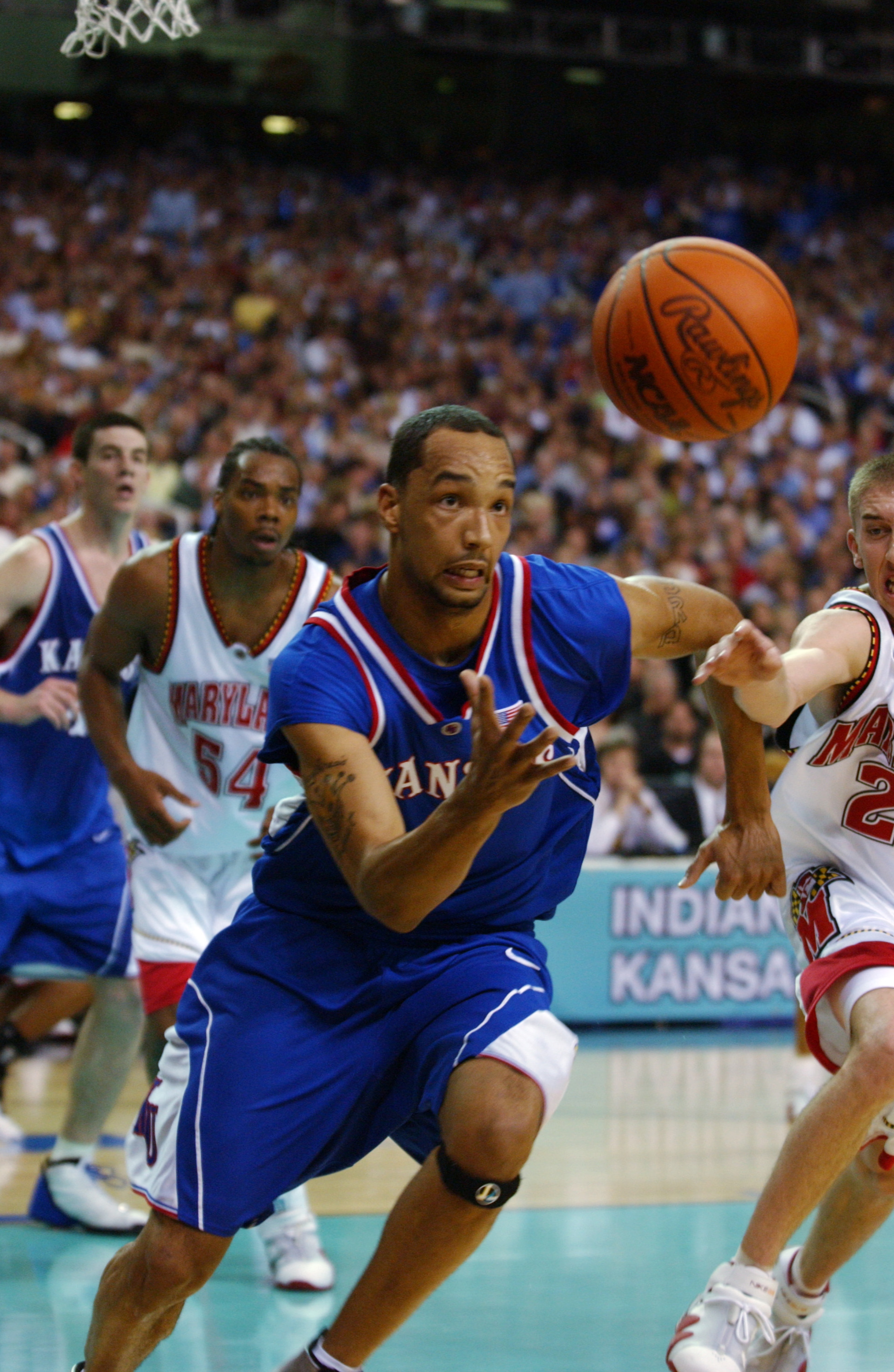30 Mar 2002: Drew Gooden #0 of Kansas scrambles for a loose ball during the semifinal round of the NCAA Men's Final Four against Maryland at the Georgia Dome in Atlanta, Georgia. DIGITAL IMAGE Mandatory Credit: Doug Pensinger/ Getty Images 30 Mar 2002: Drew Gooden #0 of Kansas scrambles for a loose ball during the semifinal round of the NCAA Men's Final Four against Maryland at the Georgia Dome in Atlanta, Georgia. DIGITAL IMAGE Mandatory Credit: Doug Pensinger/ Getty Images
