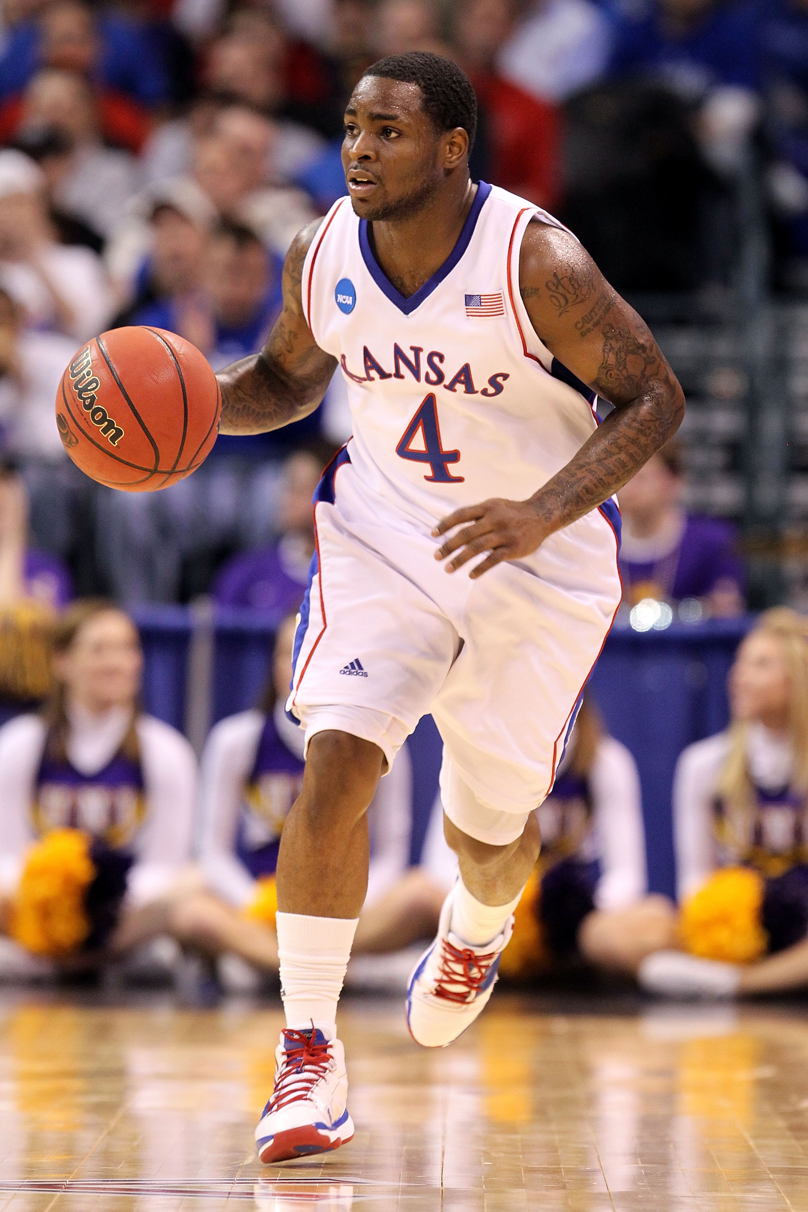 OKLAHOMA CITY - MARCH 20:  Sherron Collins #4 of the Kansas Jayhawks brings the ball up court against the Northern Iowa Panthers during the second round of the 2010 NCAA men's basketball tournament at Ford Center on March 20, 2010 in Oklahoma City, Oklaho